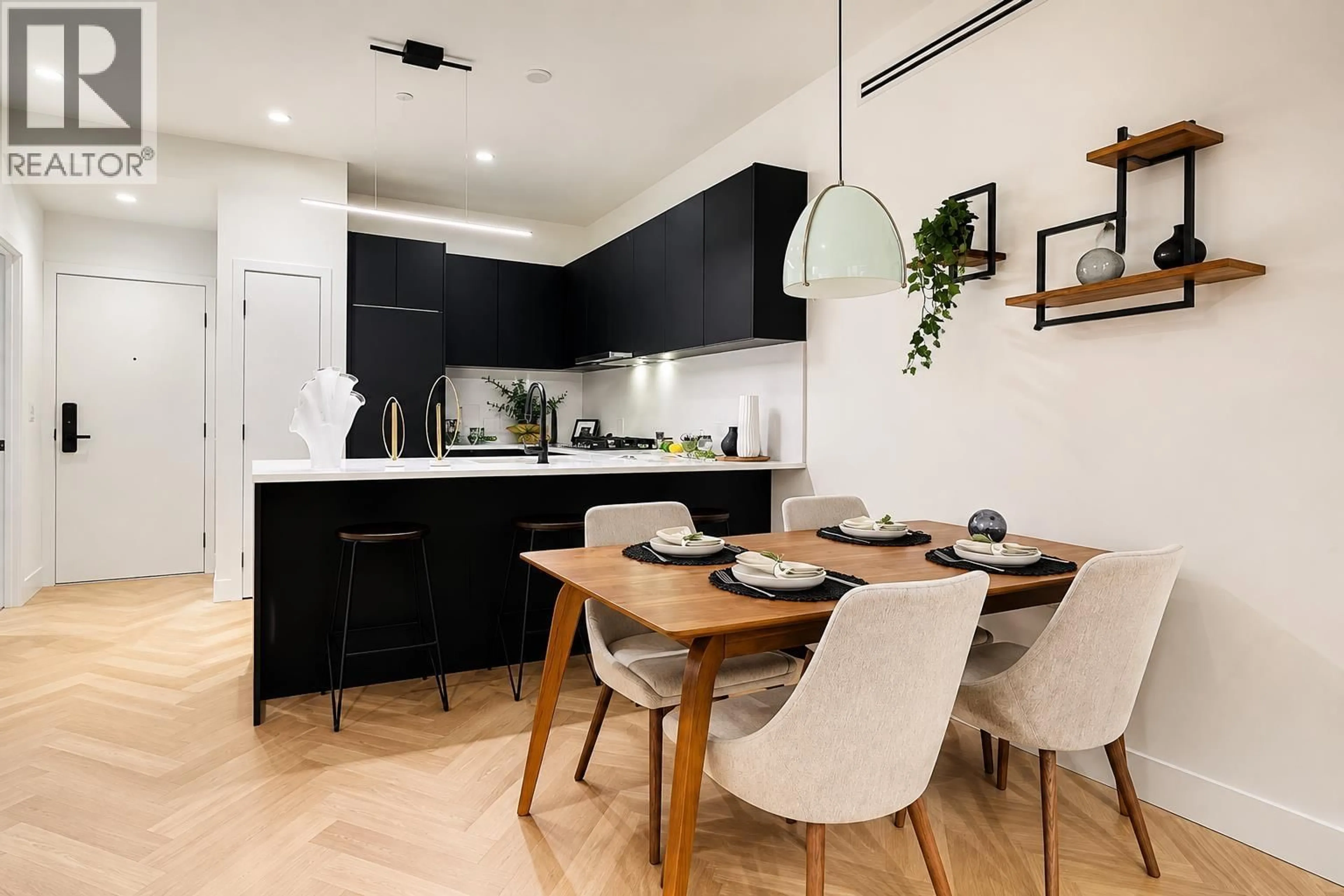 Open concept kitchen, wood/laminate floor for 217 - 599 DANSEY AVENUE, Coquitlam British Columbia V7Y1C6