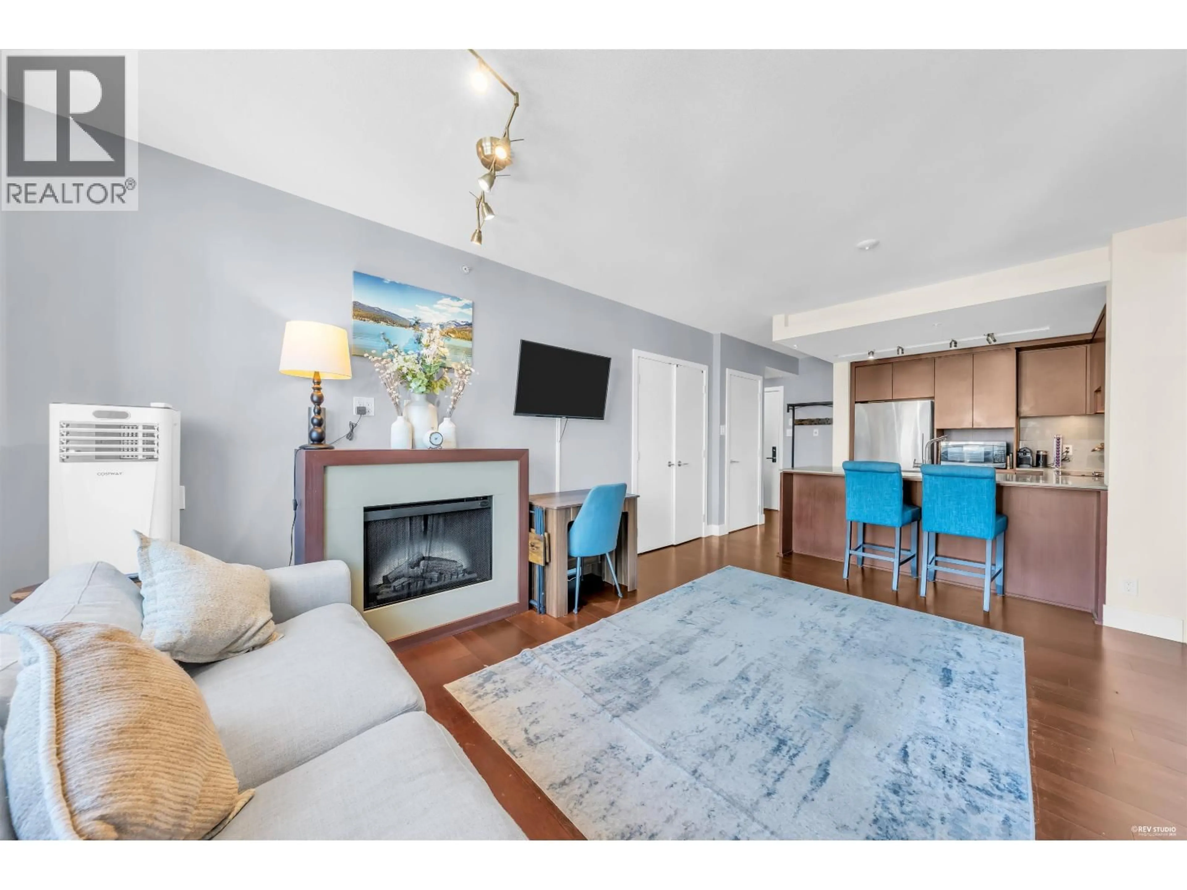 Living room with furniture, wood/laminate floor for 1301 - 158 13TH STREET, North Vancouver British Columbia V7M0A7