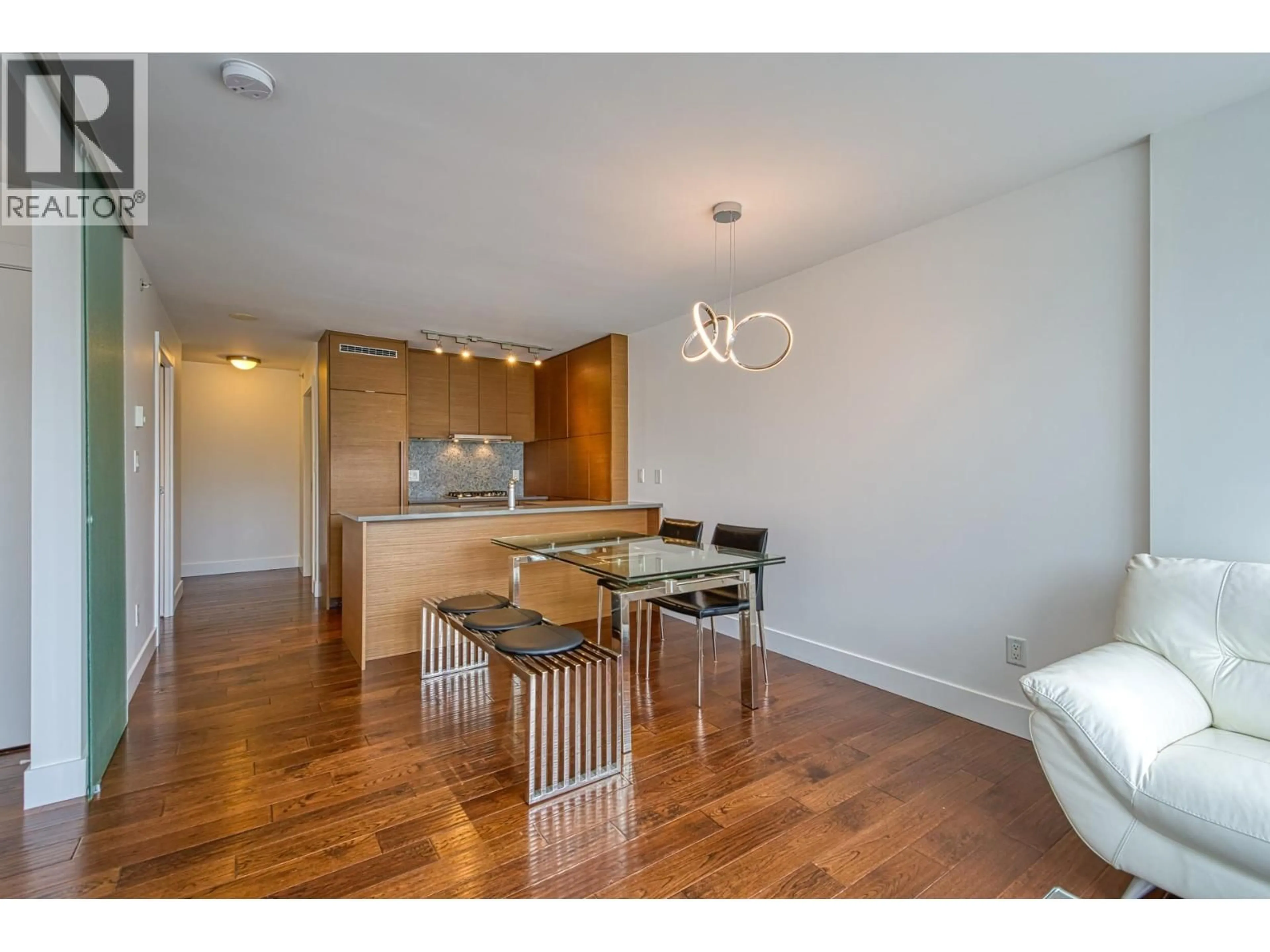 Open concept kitchen, wood/laminate floor for 104 - 565 SMITHE STREET, Vancouver British Columbia V6B0E4