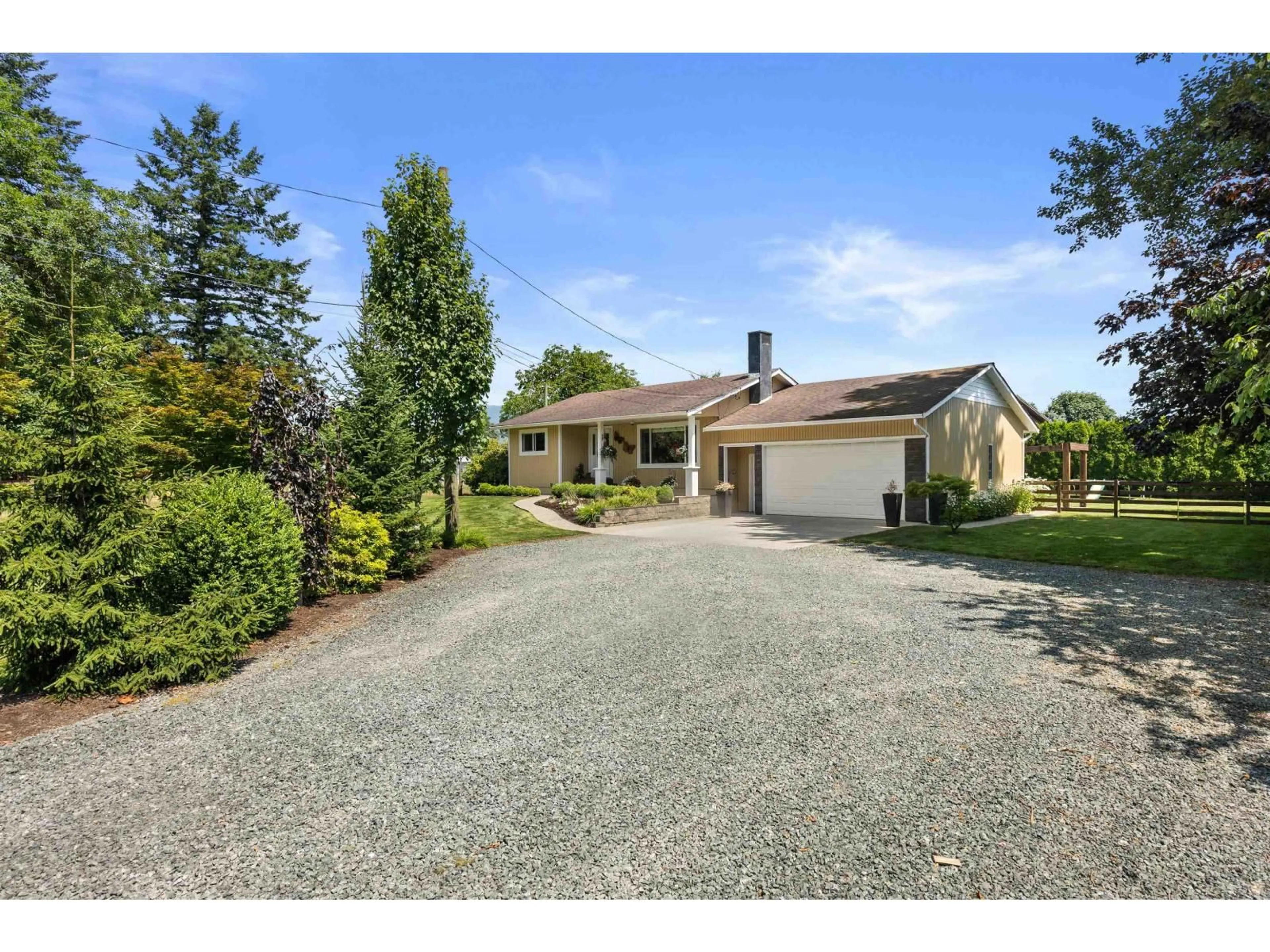 A pic from outside/outdoor area/front of a property/back of a property/a pic from drone, street for 10268 YOUNG ROAD, Chilliwack British Columbia V2P8C2