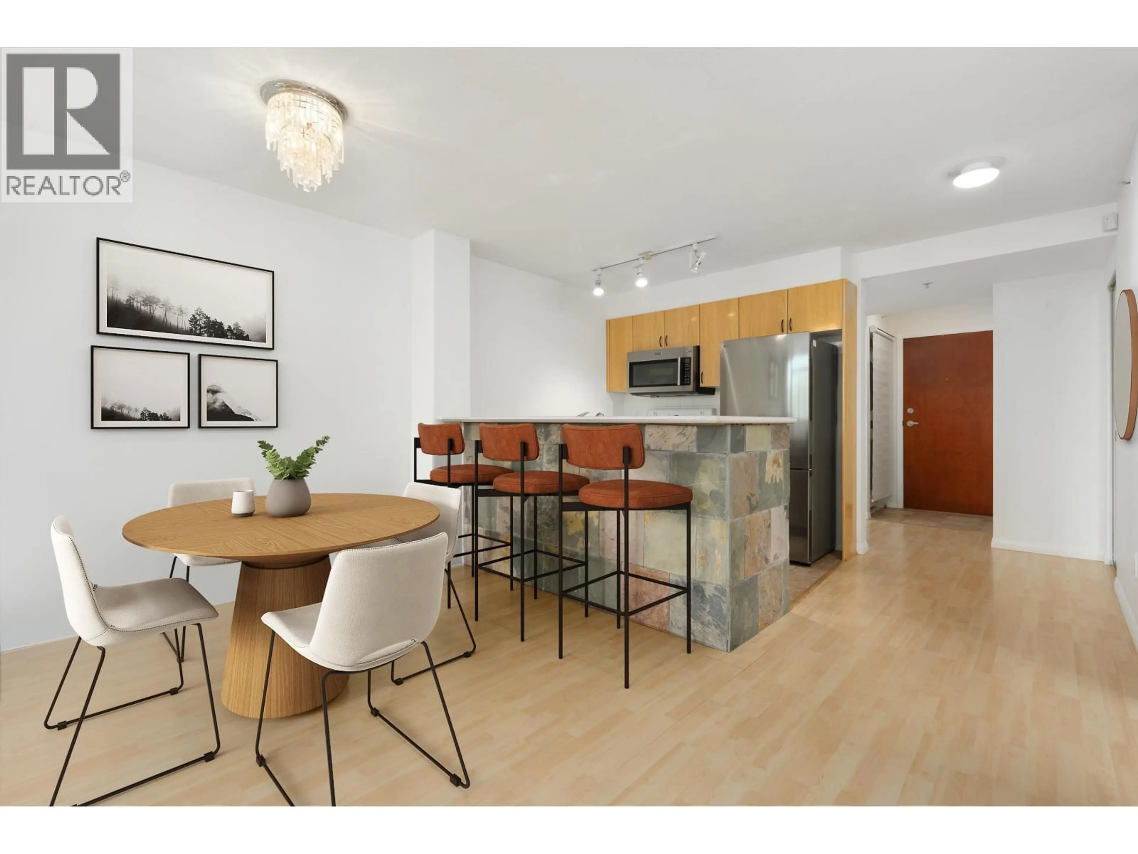 Open concept kitchen, wood/laminate floor for 1210 - 2763 CHANDLERY PLACE, Vancouver British Columbia V5S4V4
