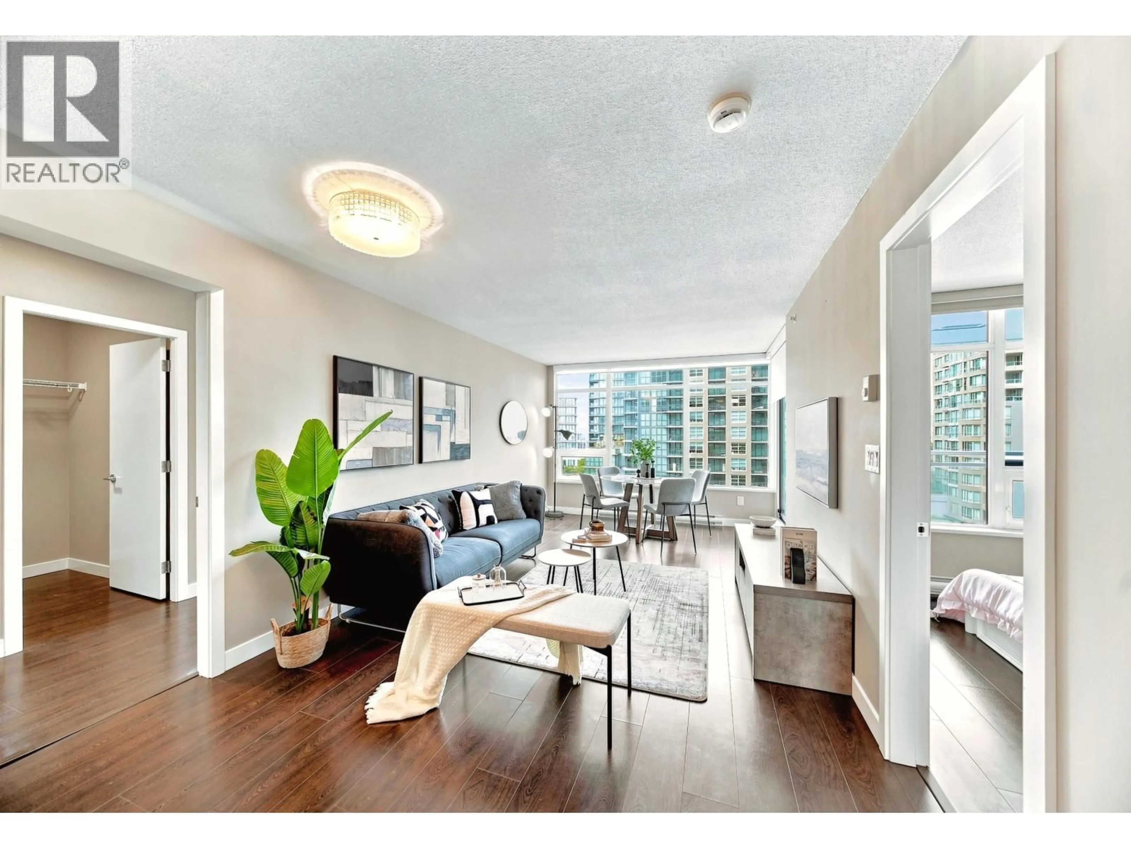 Living room with furniture, wood/laminate floor for 808 - 6188 NO. 3 ROAD, Richmond British Columbia V6Y0J3