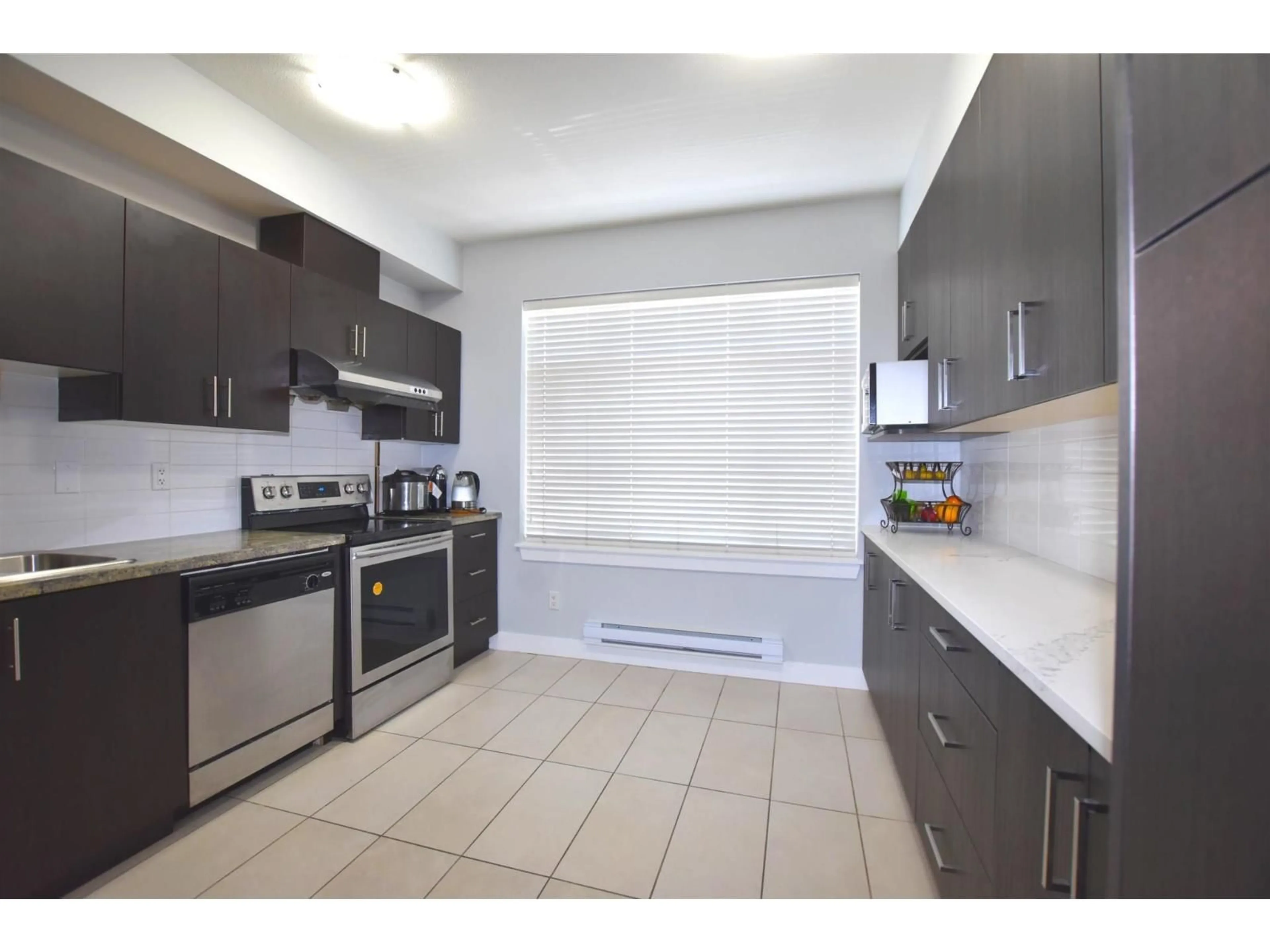 Standard kitchen, ceramic/tile floor for 2 - 13899 LAUREL DRIVE, Surrey British Columbia V3T0E3