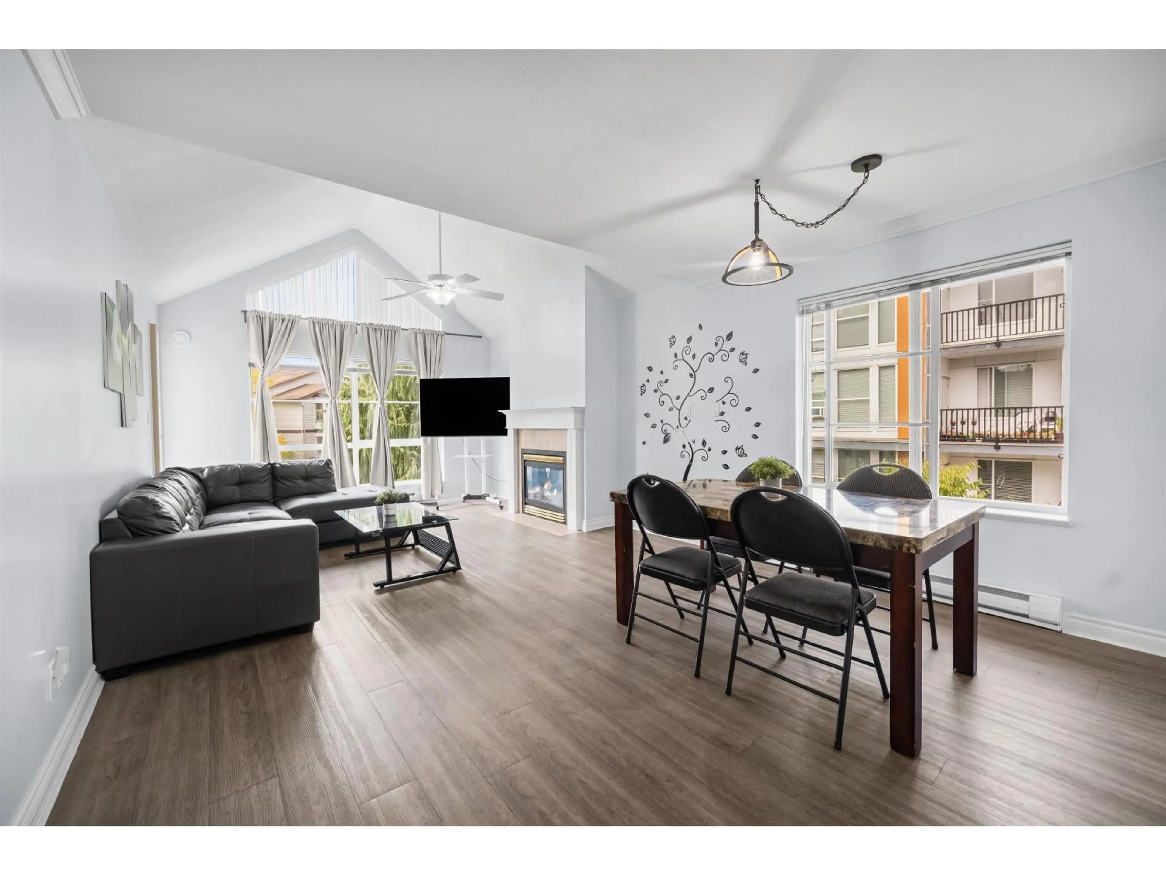 Living room with furniture, wood/laminate floor for 303 - 10130 139 STREET, Surrey British Columbia V3T4L4
