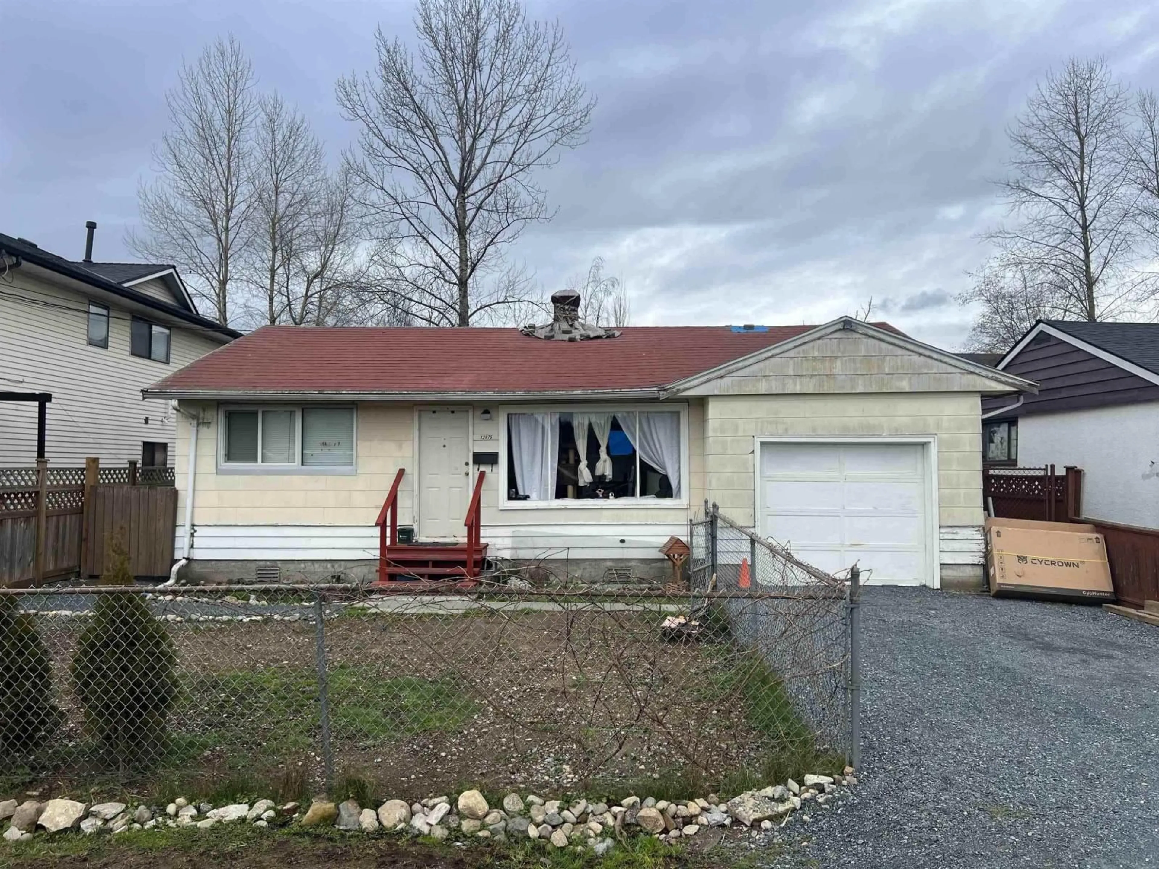 Home with vinyl exterior material, street for 12875 114A AVENUE, Surrey British Columbia V3R2N1