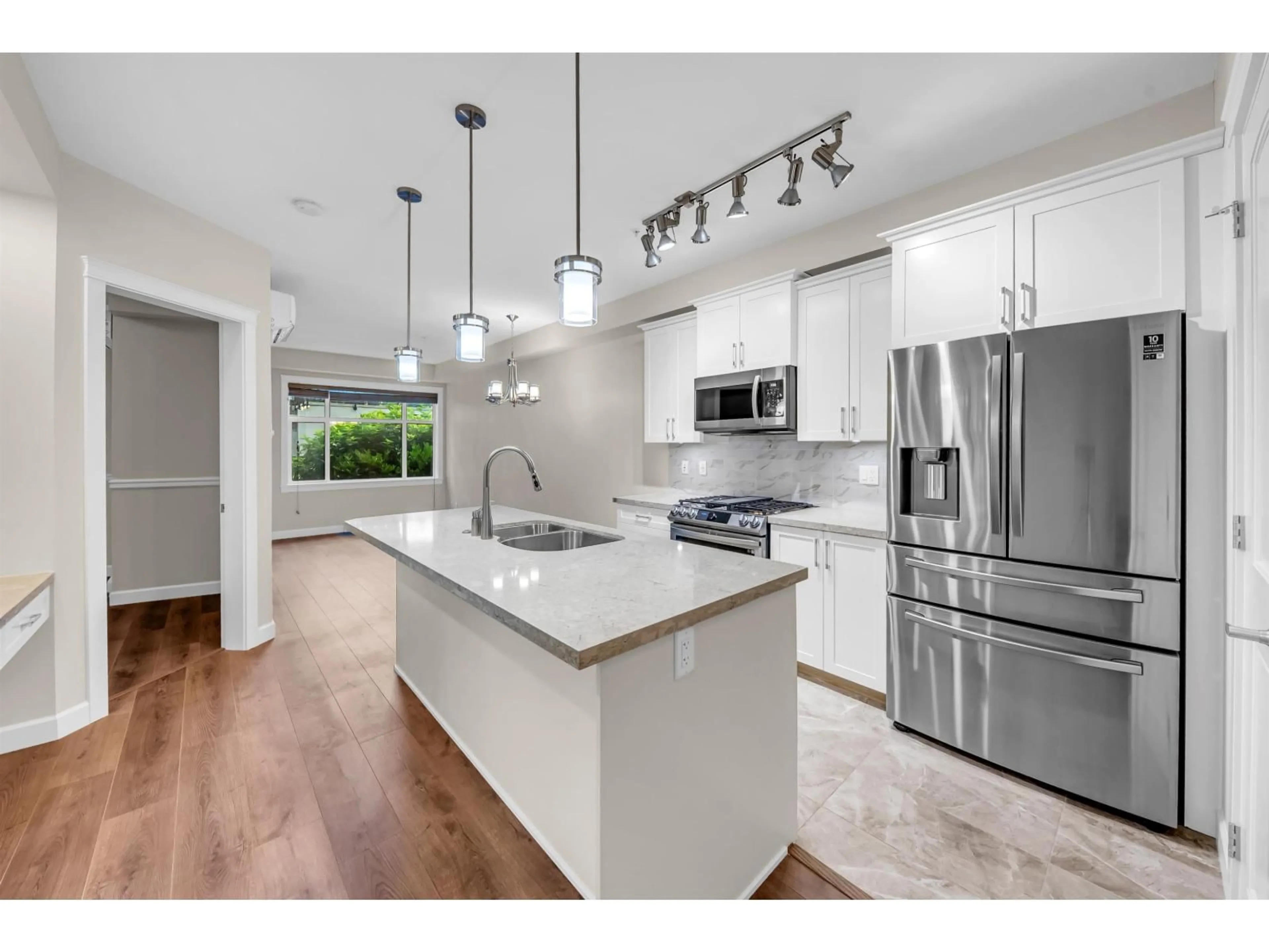 Open concept kitchen, unknown for 201 - 20328 86 AVENUE, Langley British Columbia V2Y3L5
