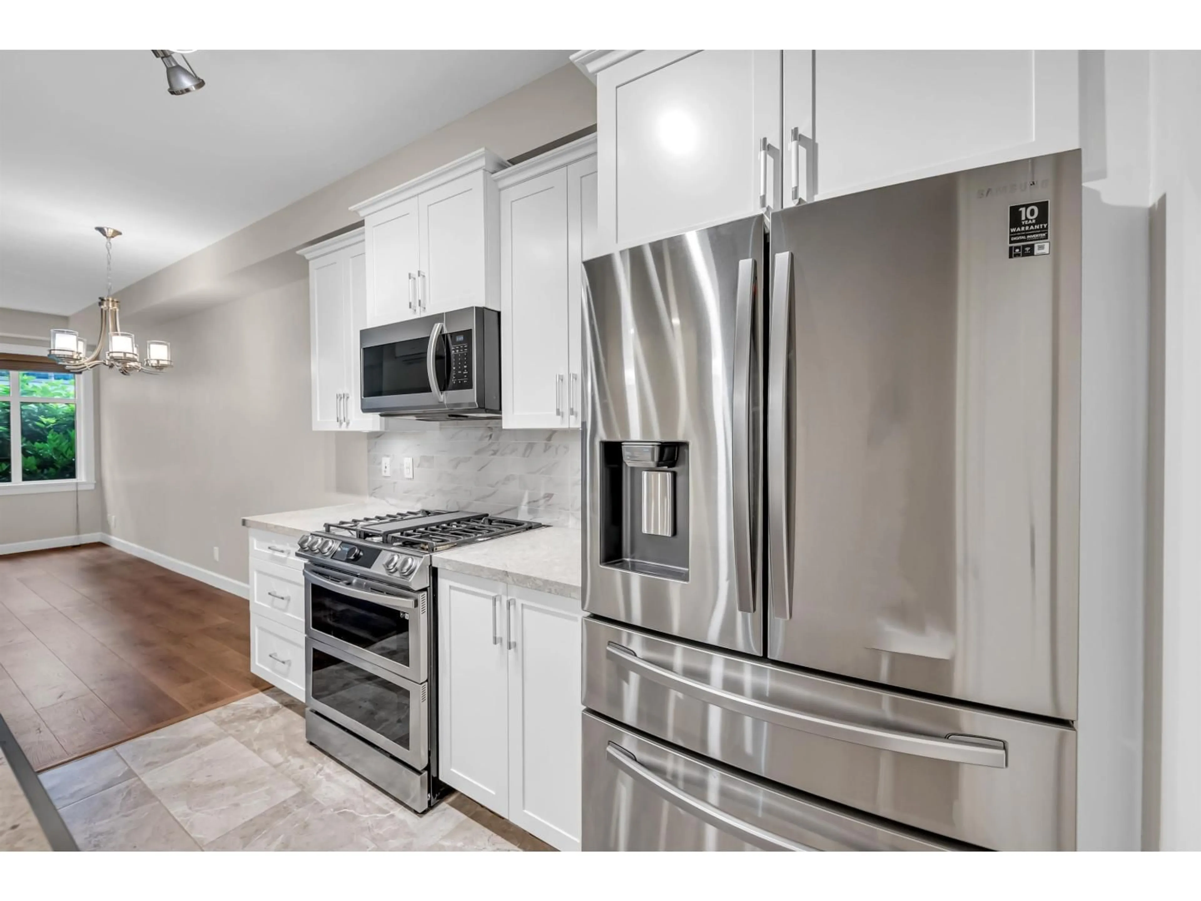 Open concept kitchen, unknown for 201 - 20328 86 AVENUE, Langley British Columbia V2Y3L5