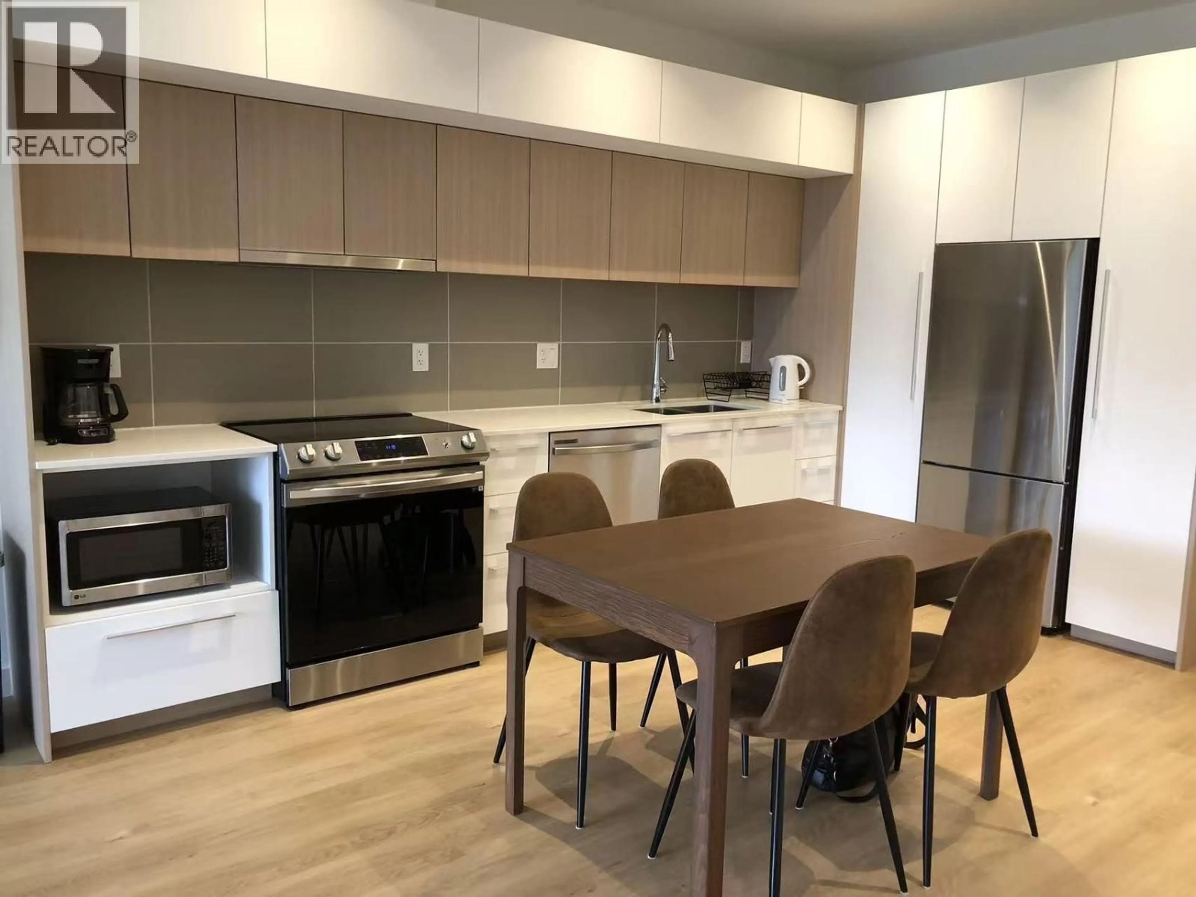 Open concept kitchen, wood/laminate floor for 601 - 9888 UNIVERSITY CRESCENT, Burnaby British Columbia V5A0G4