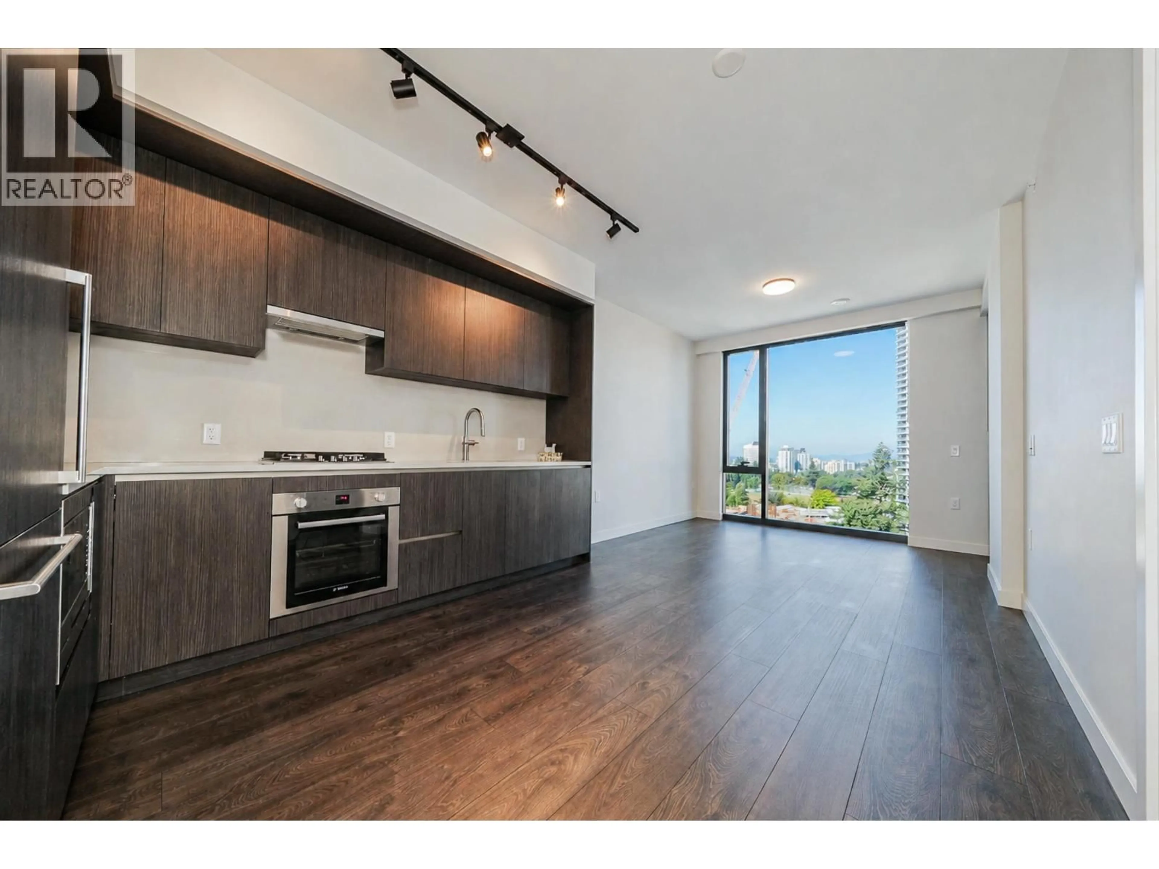 Open concept kitchen, wood/laminate floor for 1006 - 5987 WILSON AVENUE, Burnaby British Columbia V5H0L7