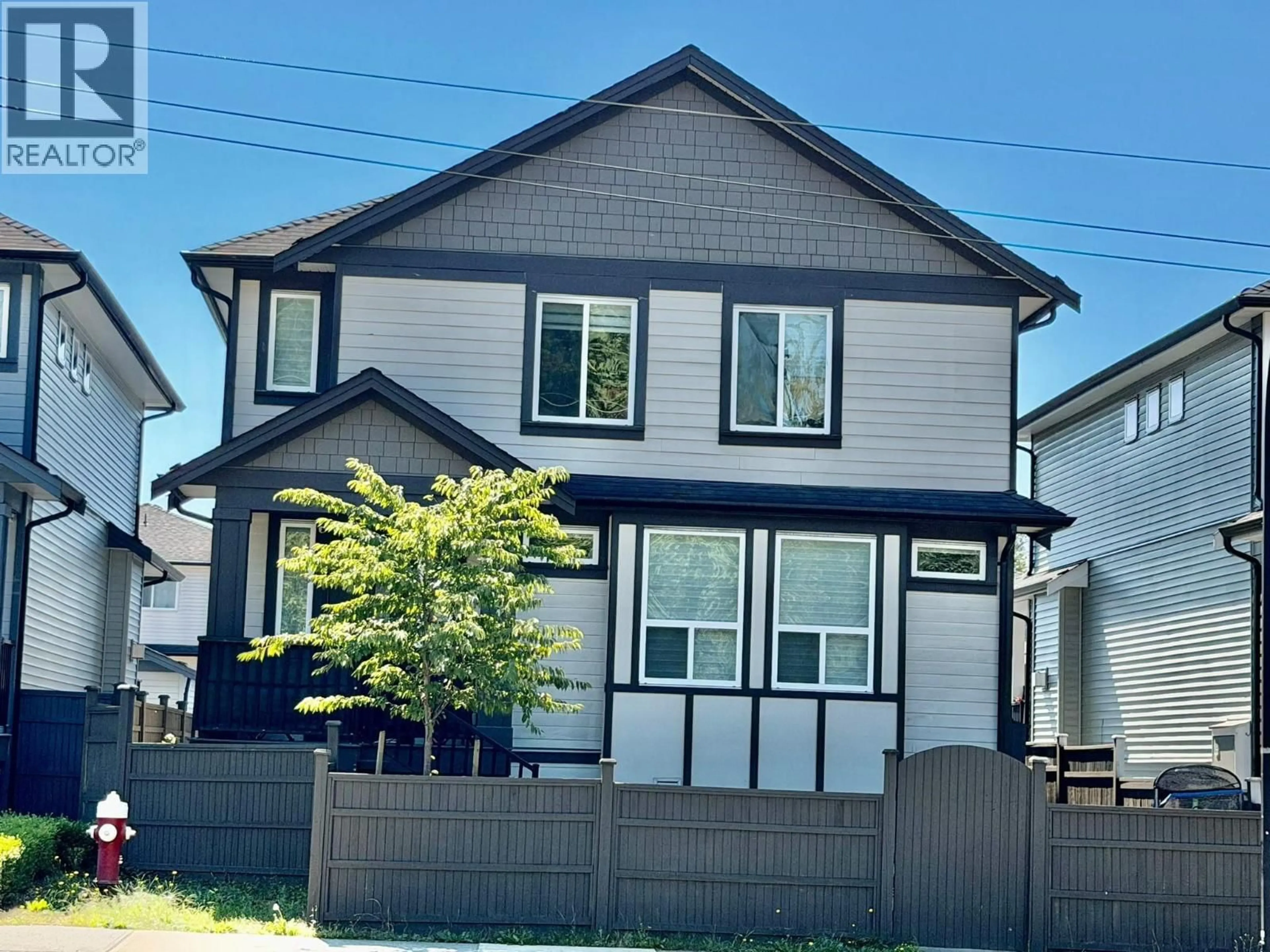 Home with vinyl exterior material, street for 23912 DEWDNEY TRUNK ROAD, Maple Ridge British Columbia V4R1W2