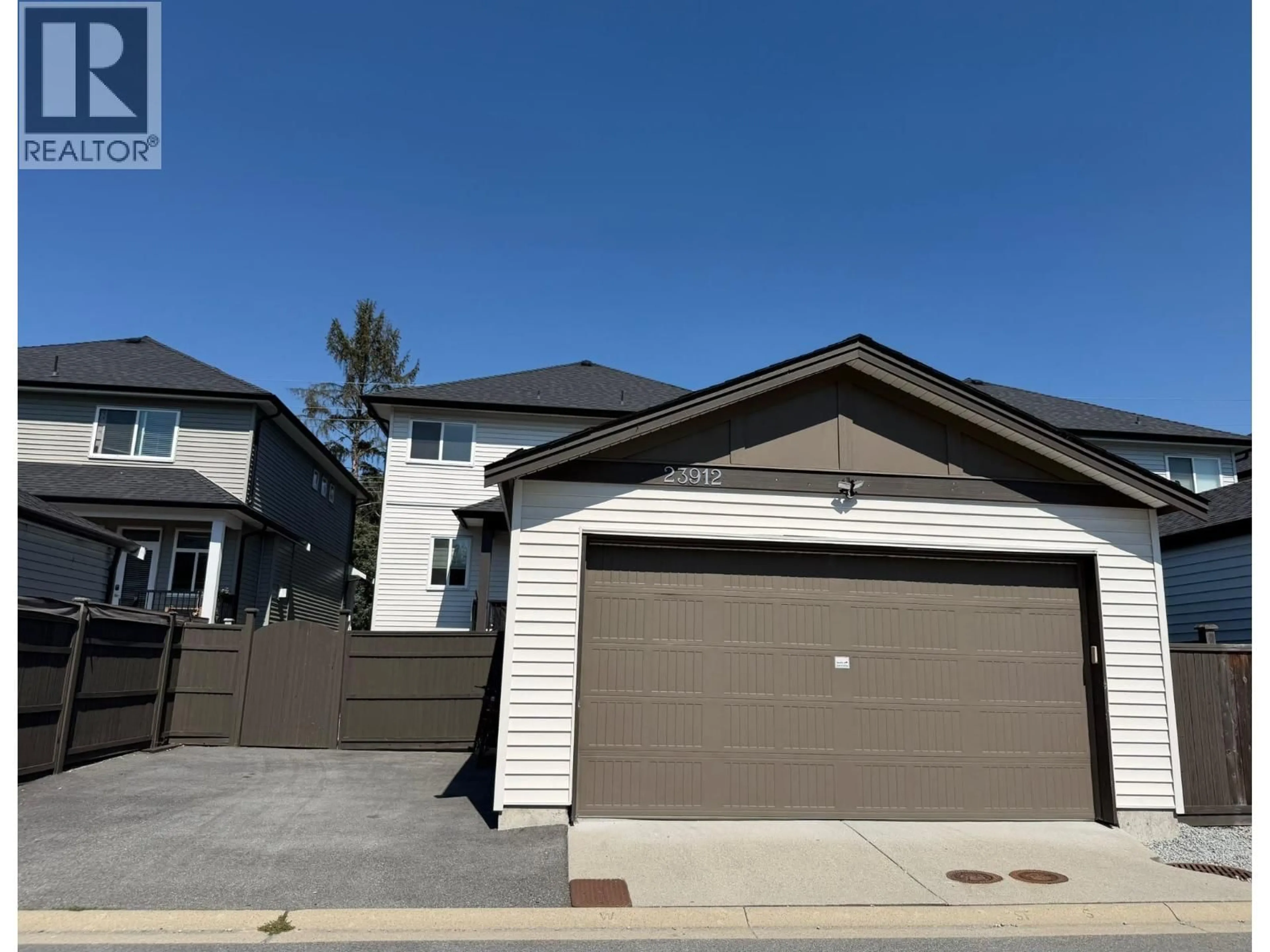 Home with vinyl exterior material, street for 23912 DEWDNEY TRUNK ROAD, Maple Ridge British Columbia V4R1W2