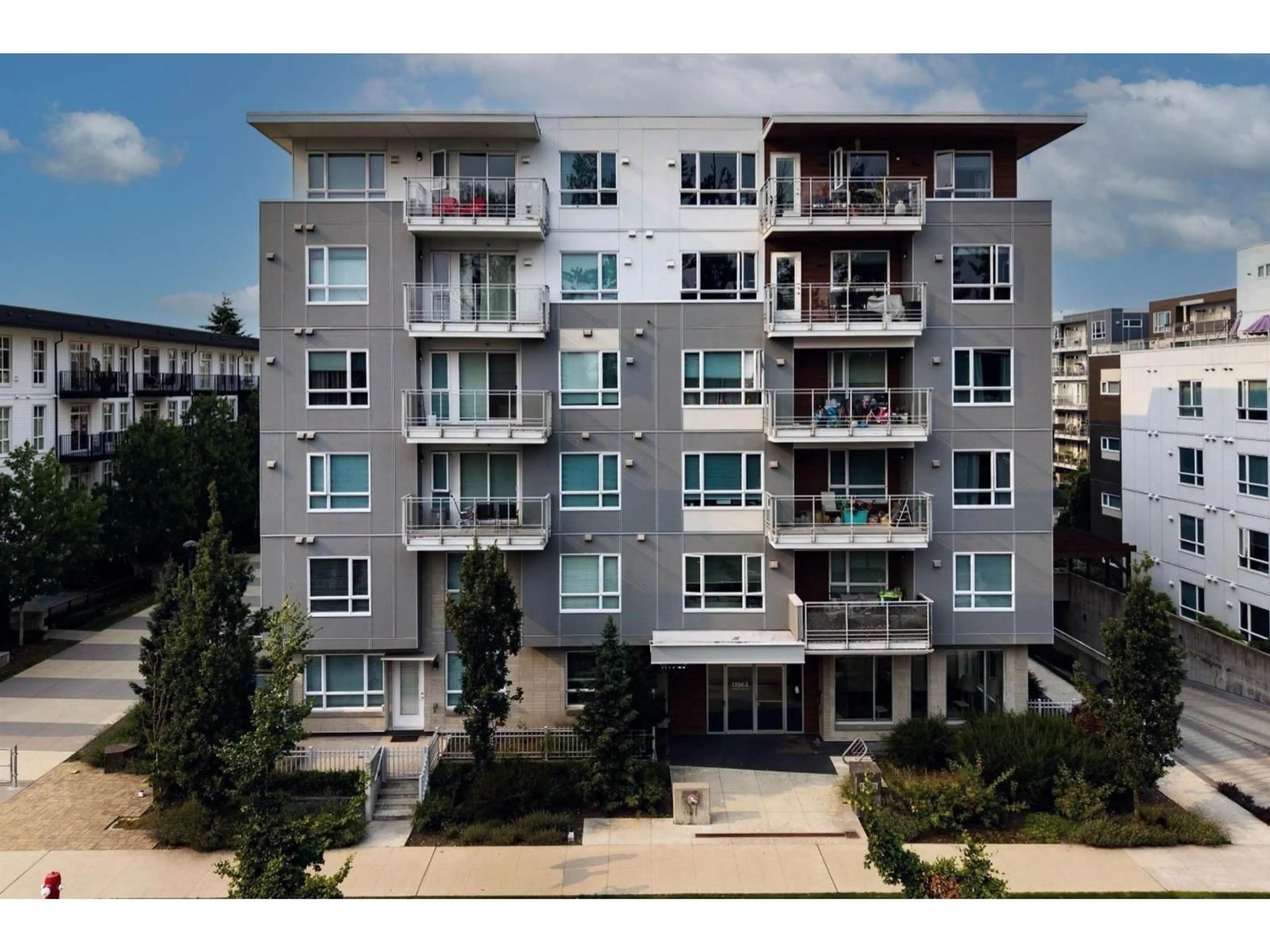 A pic from outside/outdoor area/front of a property/back of a property/a pic from drone, building for 118 - 13963 105 BOULEVARD, Surrey British Columbia V3T0M9