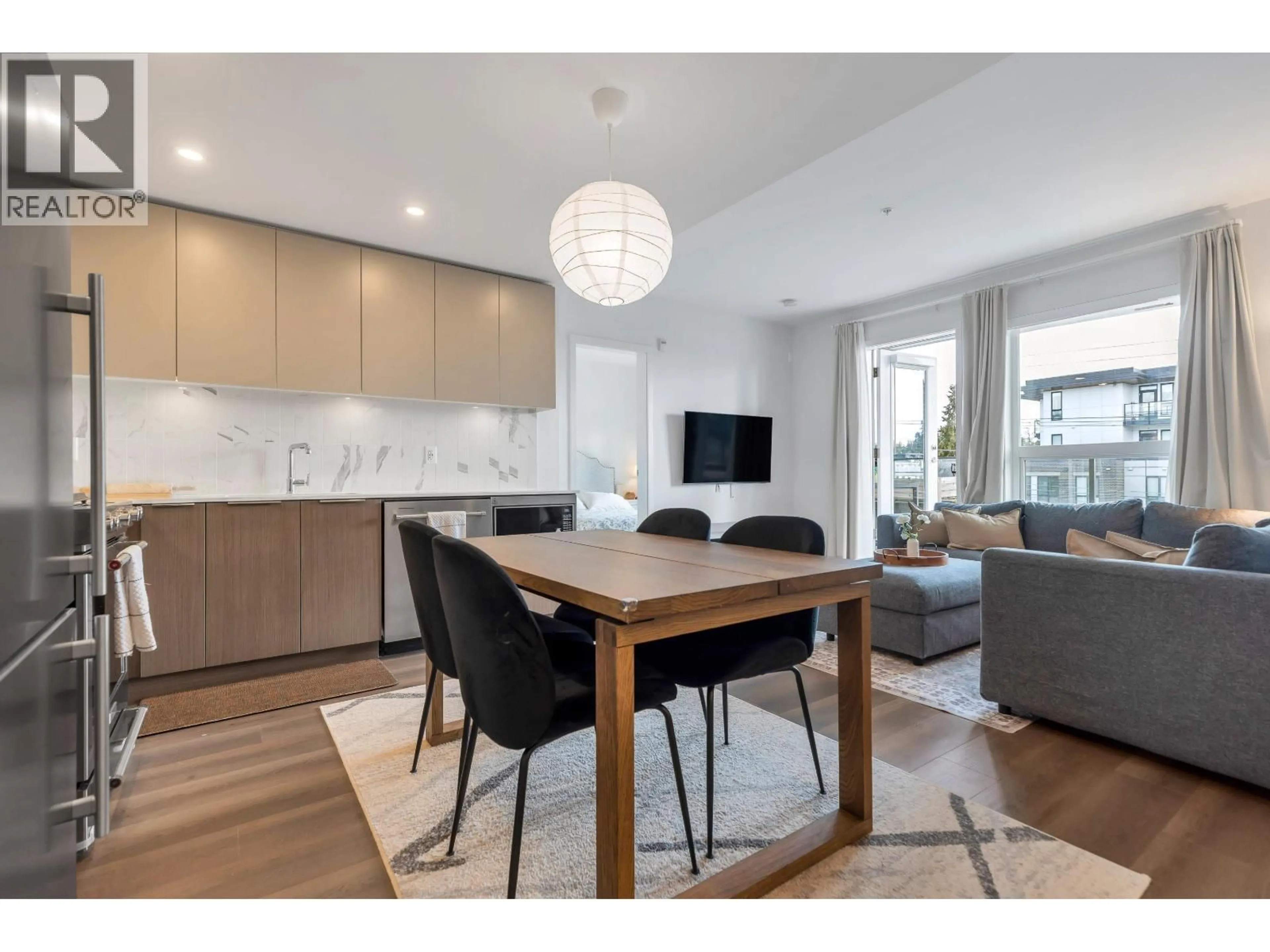 Open concept kitchen, wood/laminate floor for 504 - 645 COMO LAKE AVENUE, Coquitlam British Columbia V3J0N9