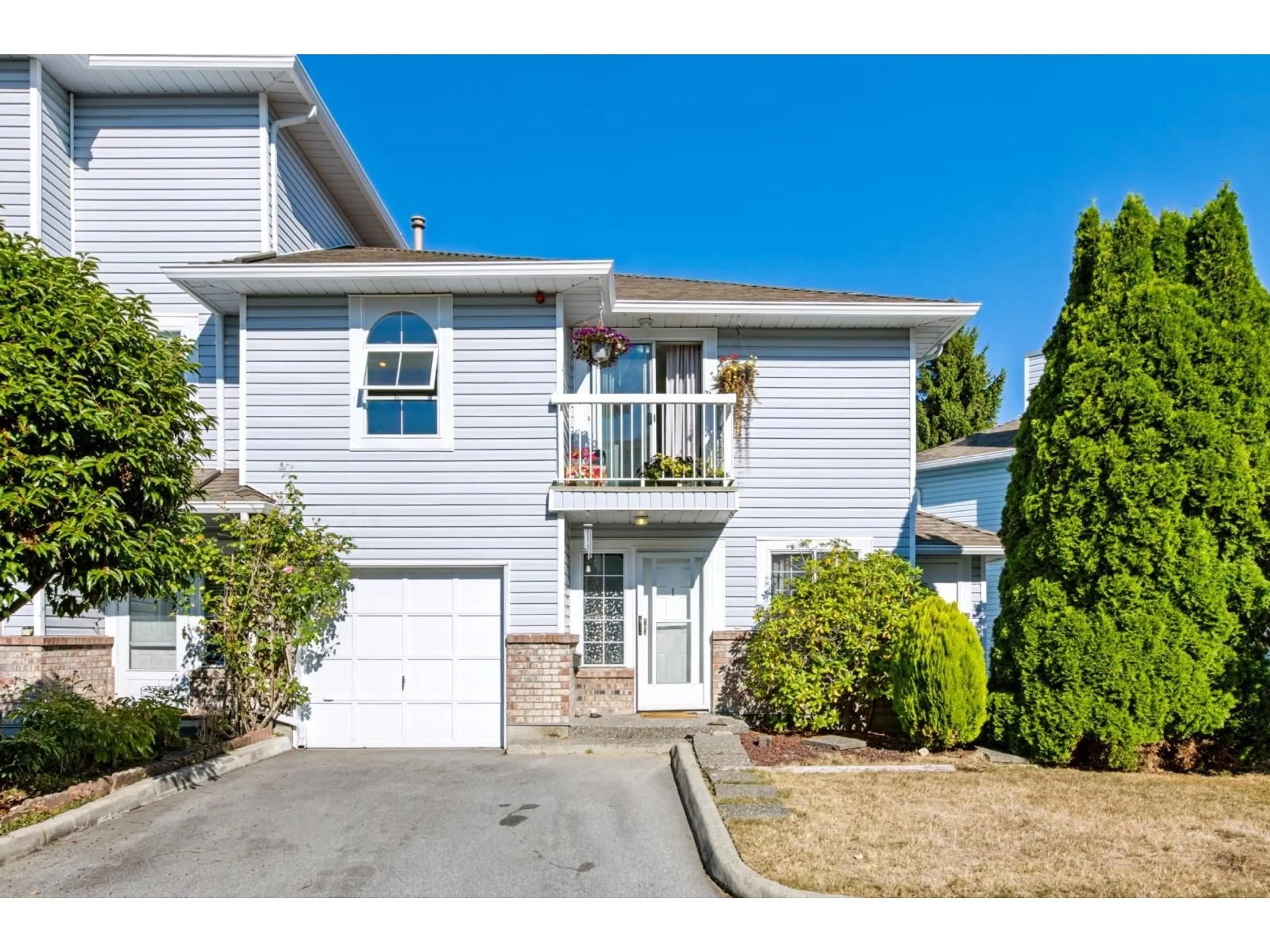 Home with vinyl exterior material, street for 1 - 13925 70 AVENUE, Surrey British Columbia V3W0A2