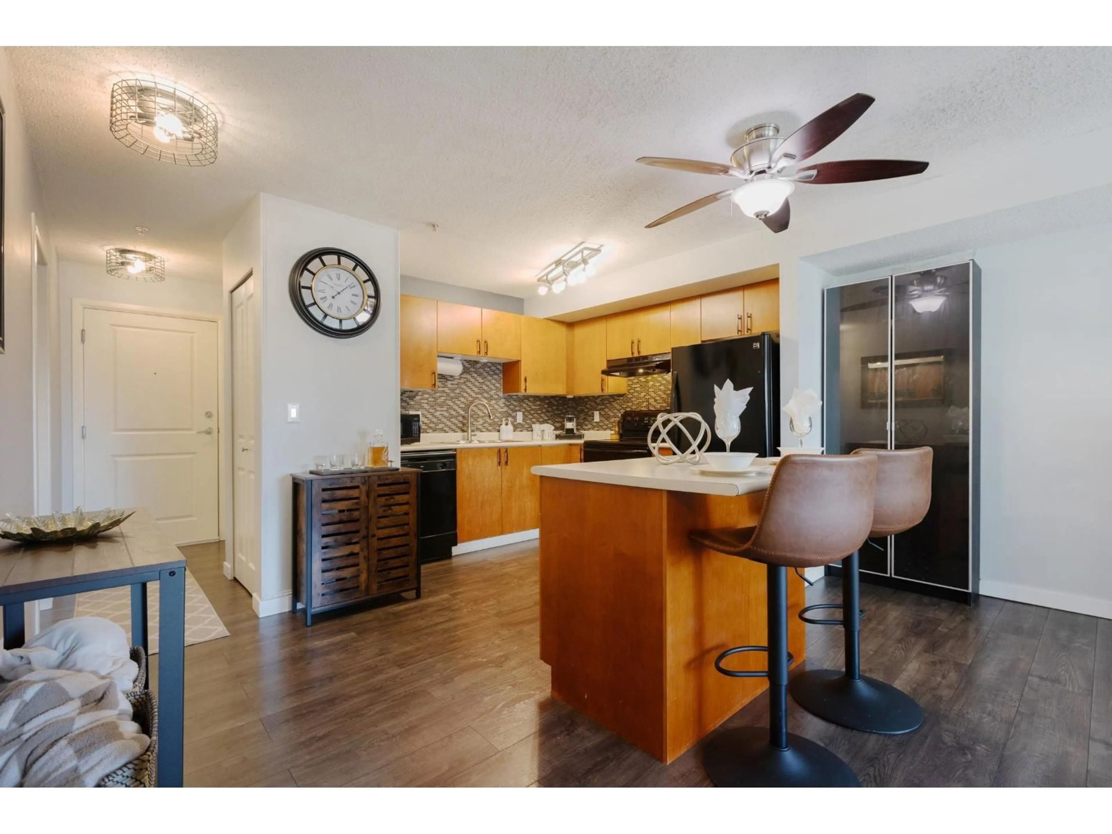 Open concept kitchen, wood/laminate floor for 306 - 5465 203 STREET, Langley British Columbia V3A9L8