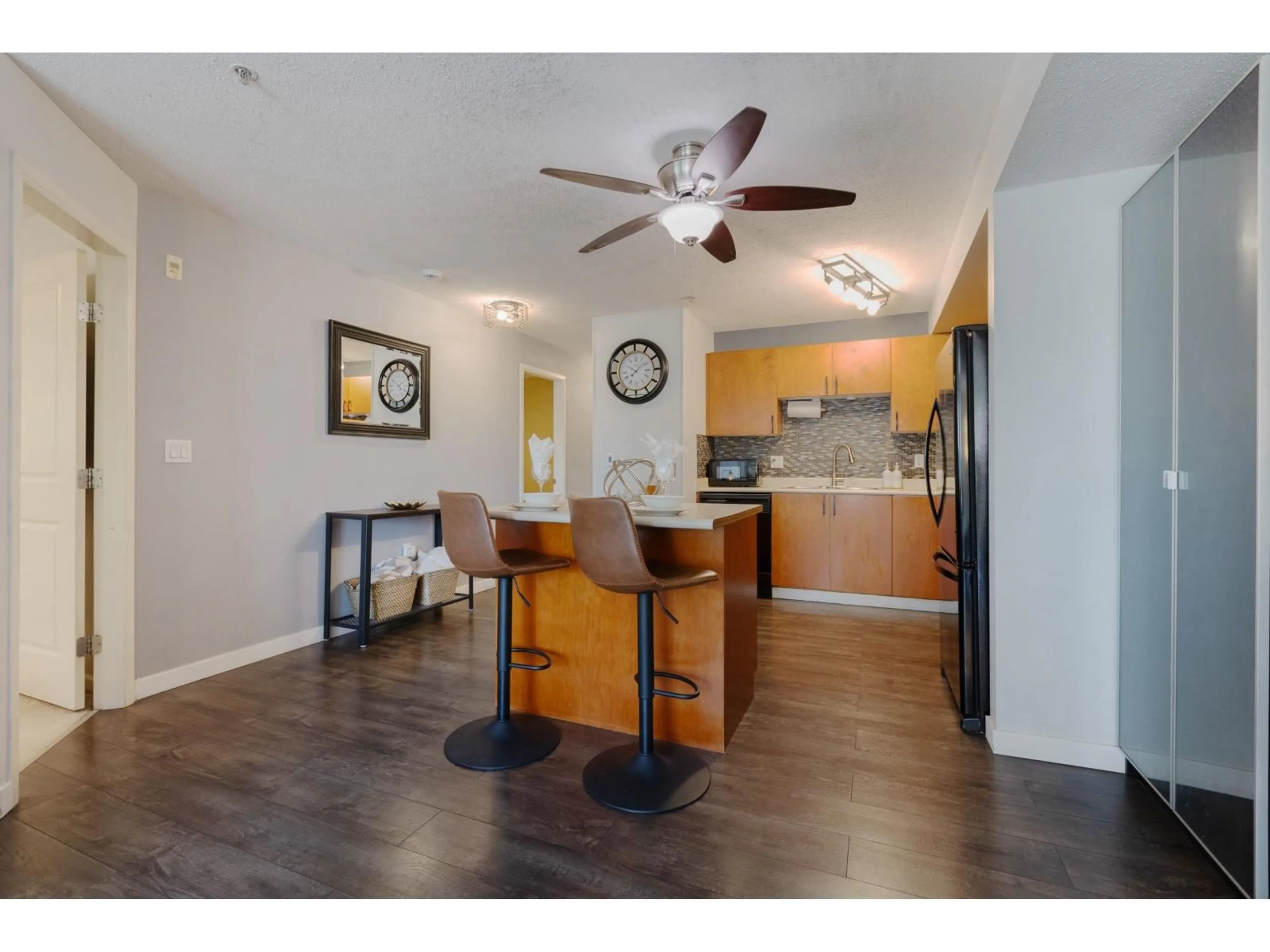Open concept kitchen, wood/laminate floor for 306 - 5465 203 STREET, Langley British Columbia V3A9L8