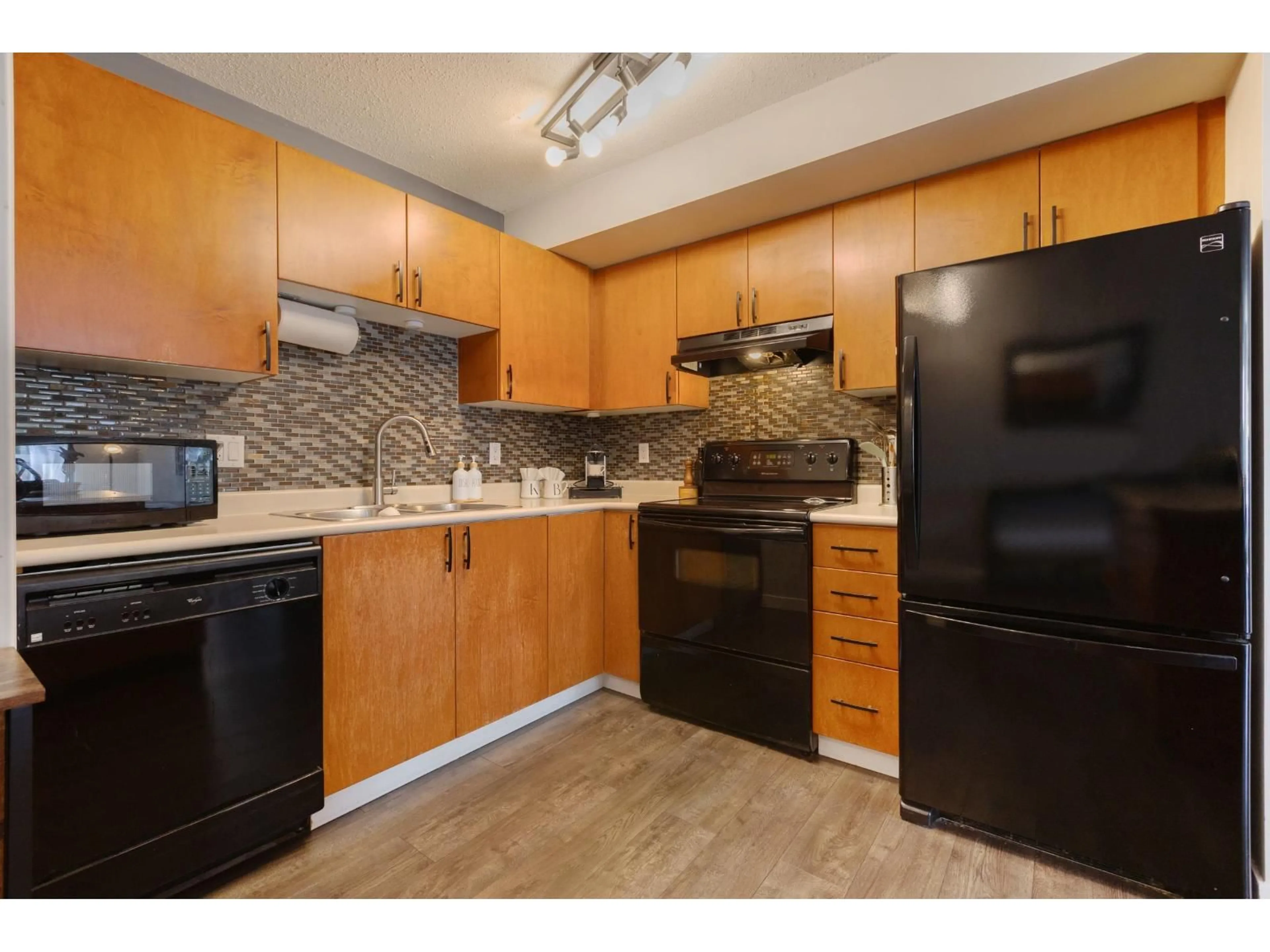 Standard kitchen, wood/laminate floor for 306 - 5465 203 STREET, Langley British Columbia V3A9L8