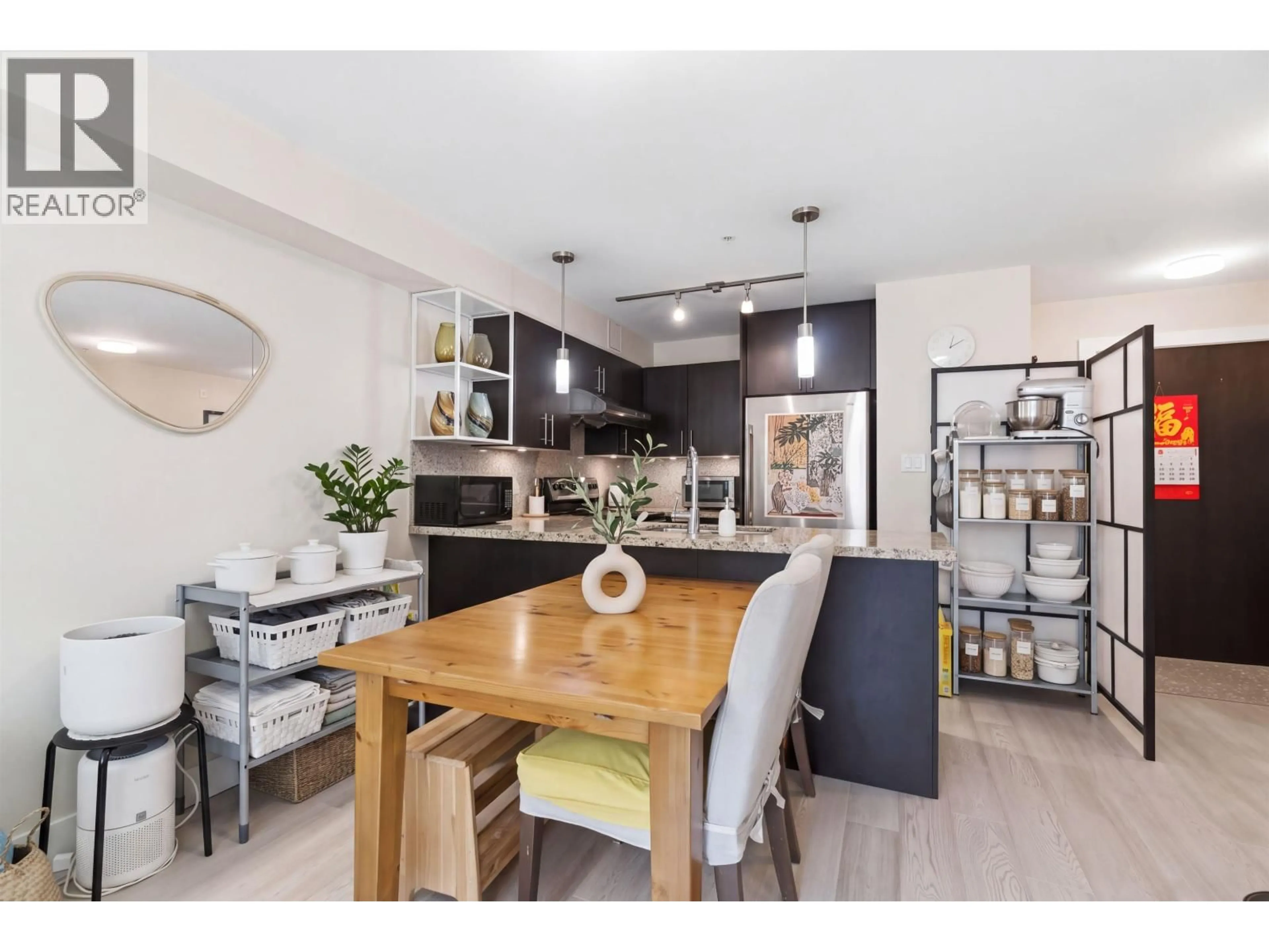 Open concept kitchen, wood/laminate floor for 202 - 3611 18TH AVENUE, Vancouver British Columbia V6S1B3