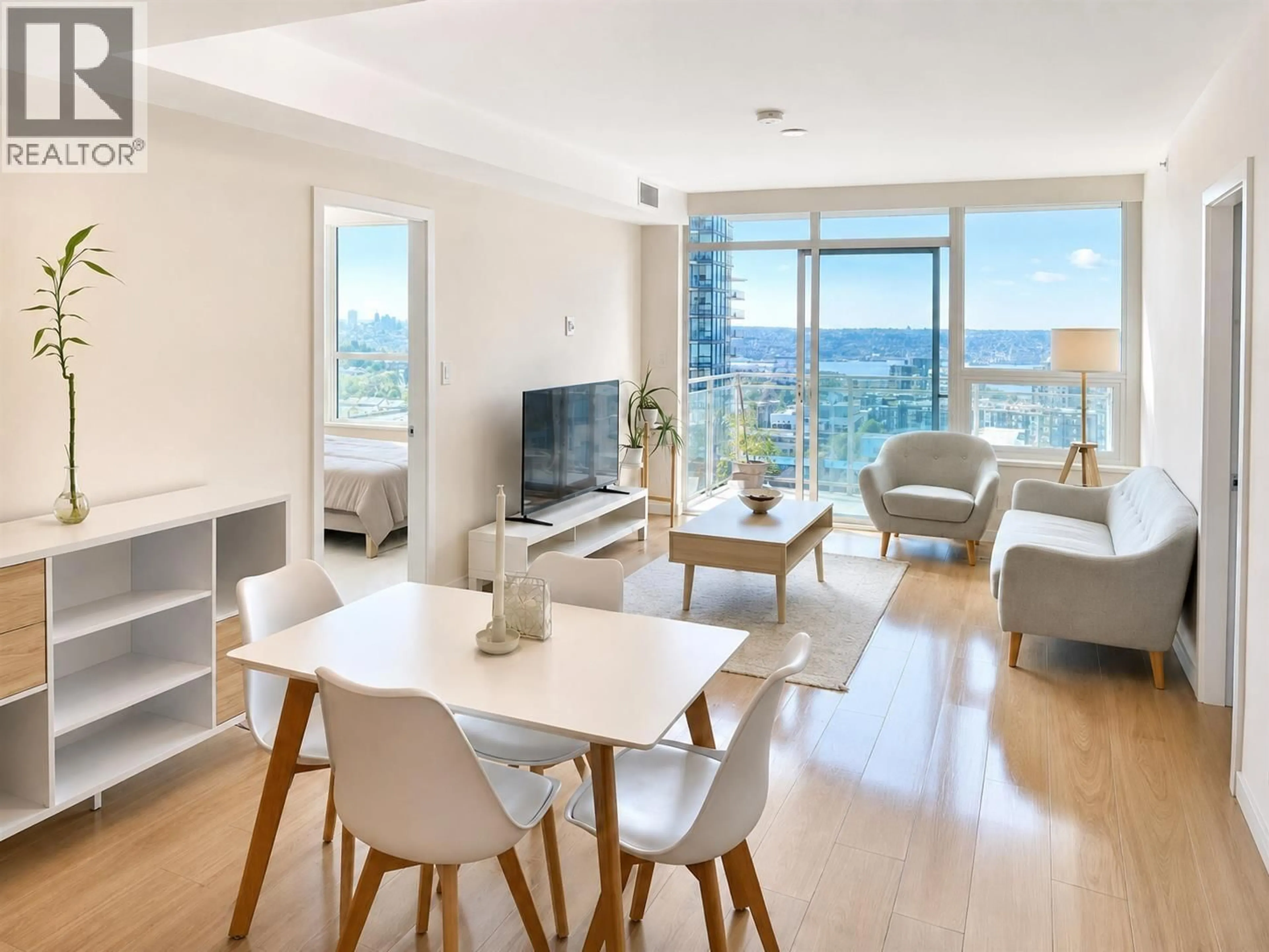 Living room with furniture, wood/laminate floor for 1403 - 125 14TH STREET, North Vancouver British Columbia V7L0E6