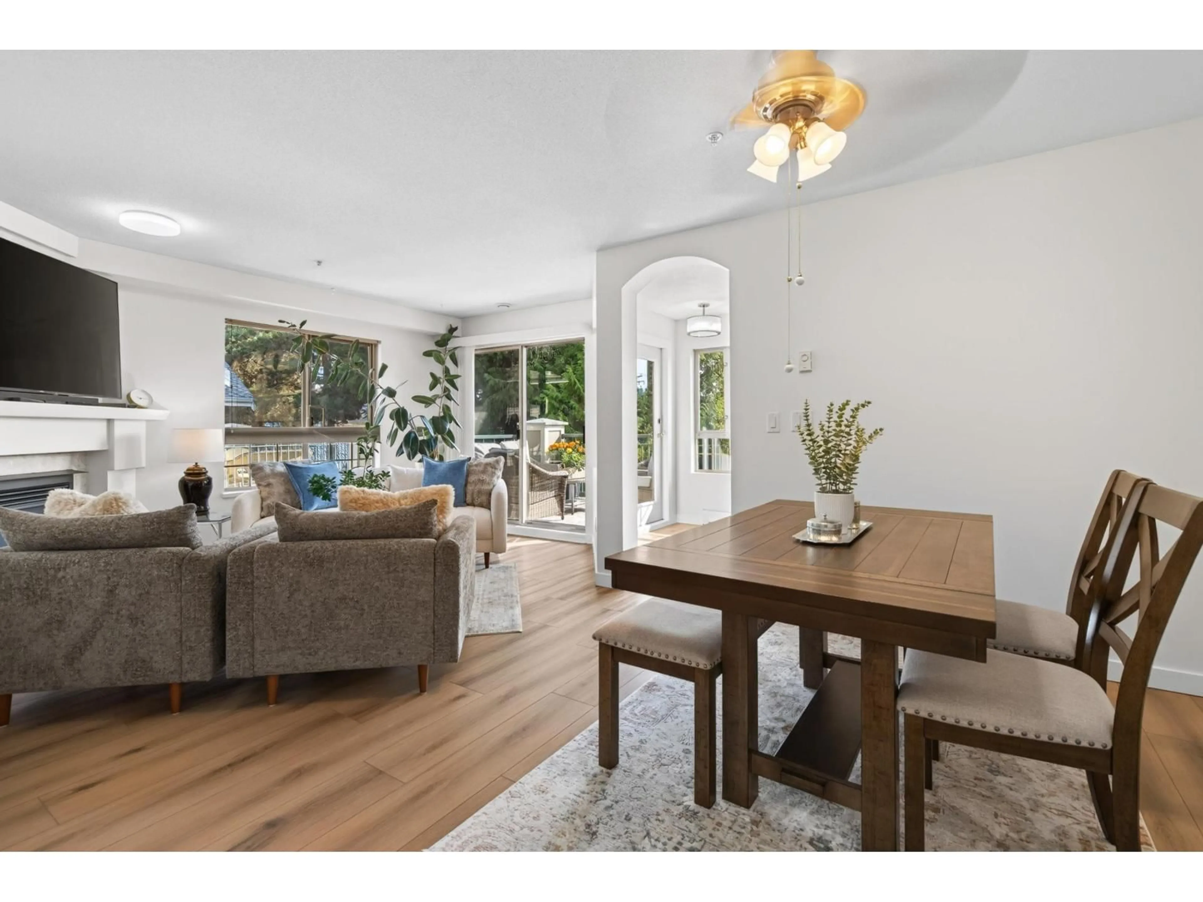 Living room with furniture, wood/laminate floor for 313 - 22025 48 AVENUE, Langley British Columbia V3A8L2
