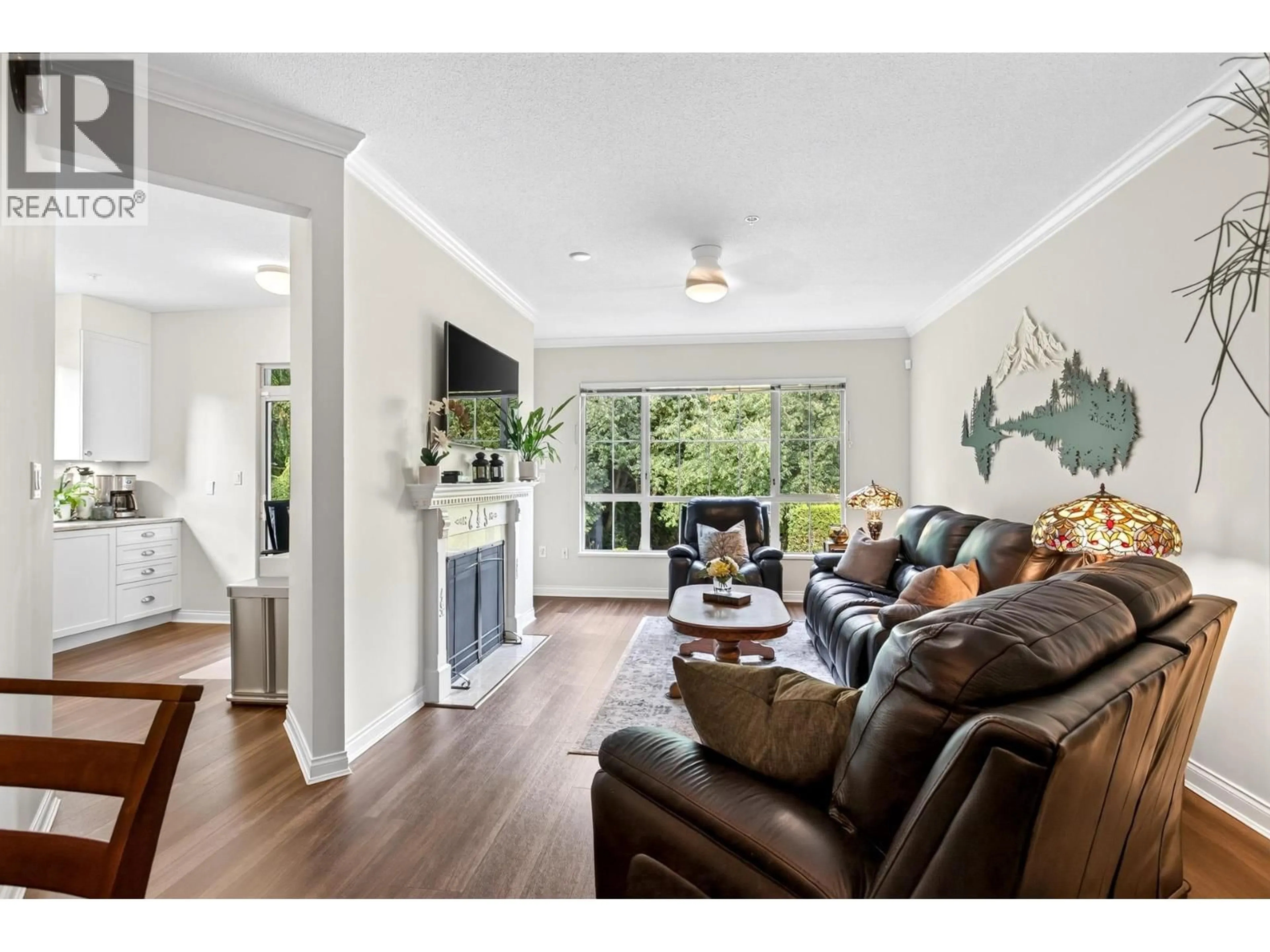 Living room with furniture, wood/laminate floor for 218 - 2985 PRINCESS CRESCENT, Coquitlam British Columbia V3B7P3