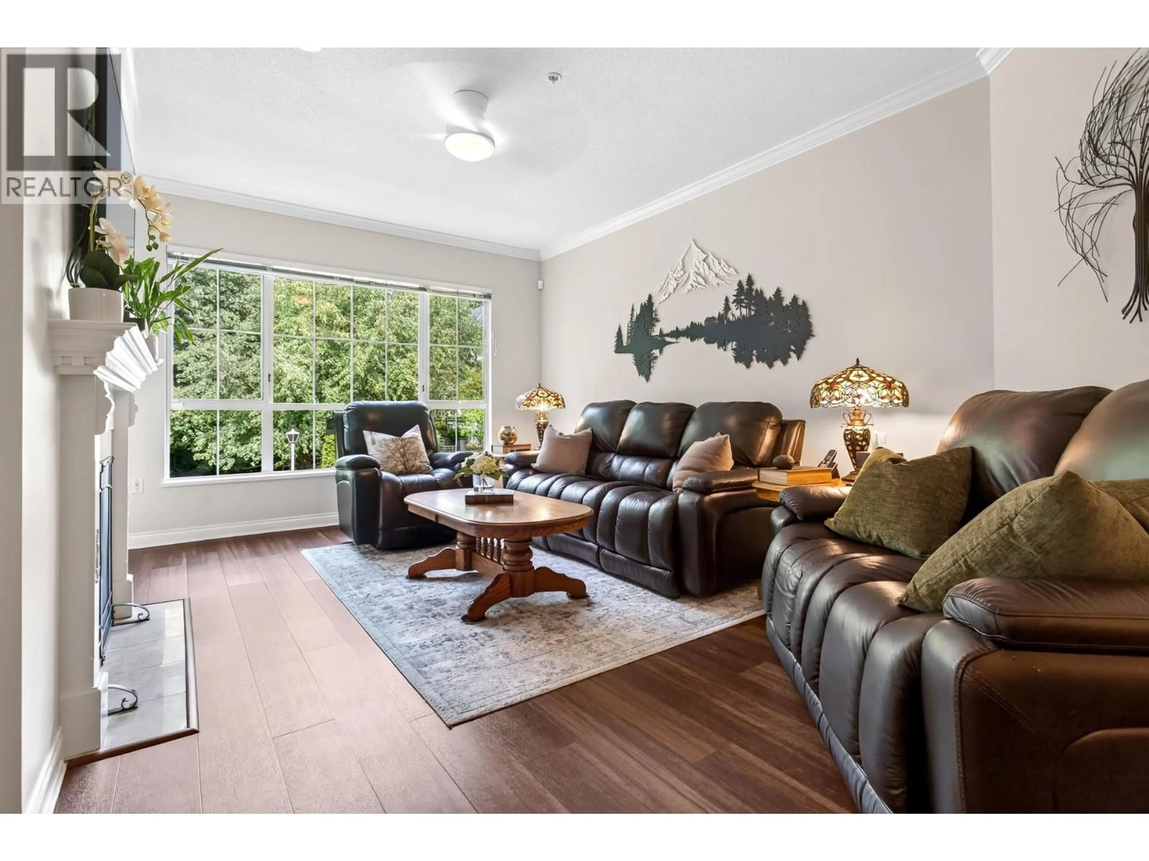 Living room with furniture, wood/laminate floor for 218 - 2985 PRINCESS CRESCENT, Coquitlam British Columbia V3B7P3