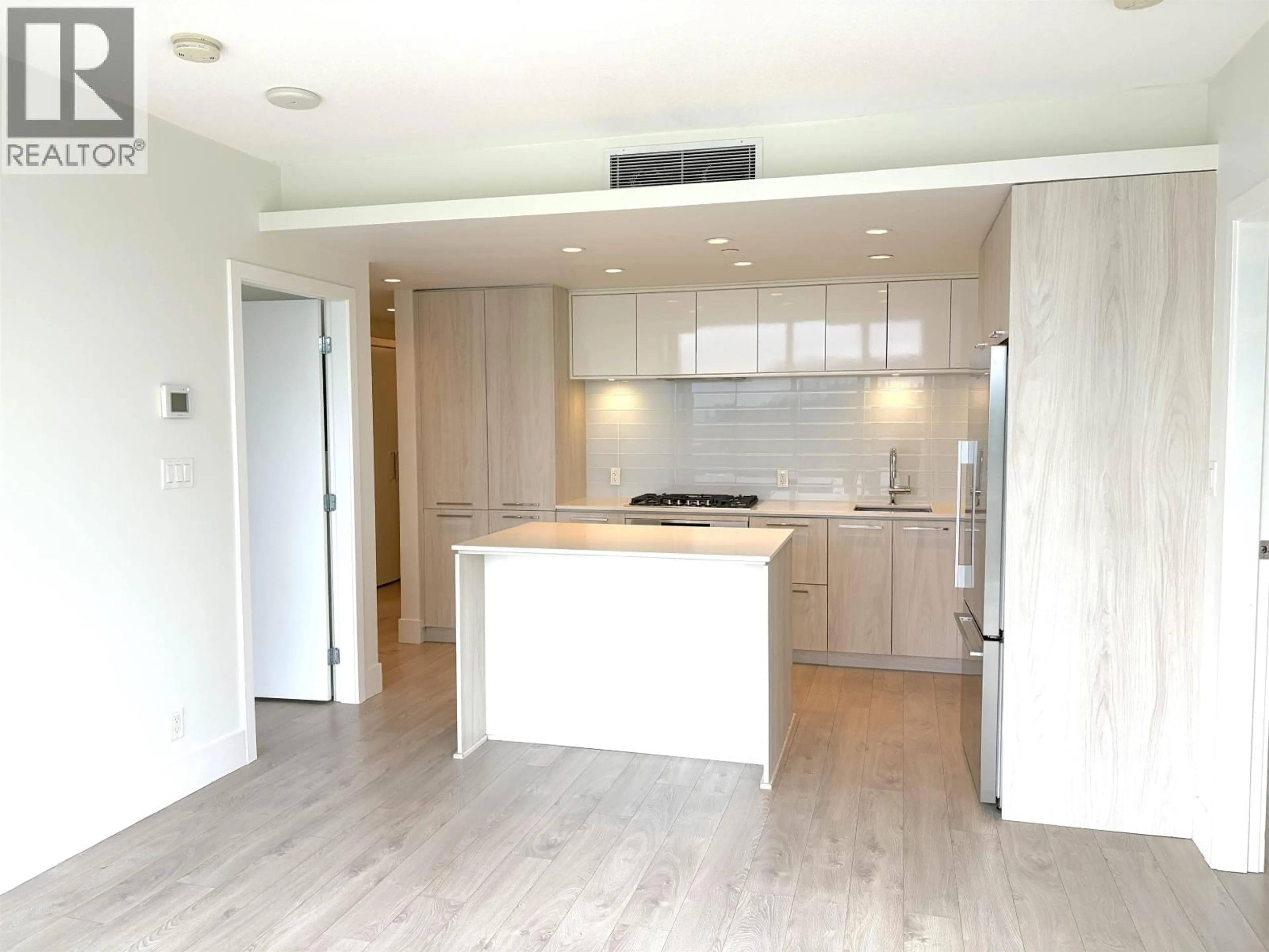 Open concept kitchen, wood/laminate floor for 1502 - 680 SEYLYNN CRESCENT, North Vancouver British Columbia V7J0B5