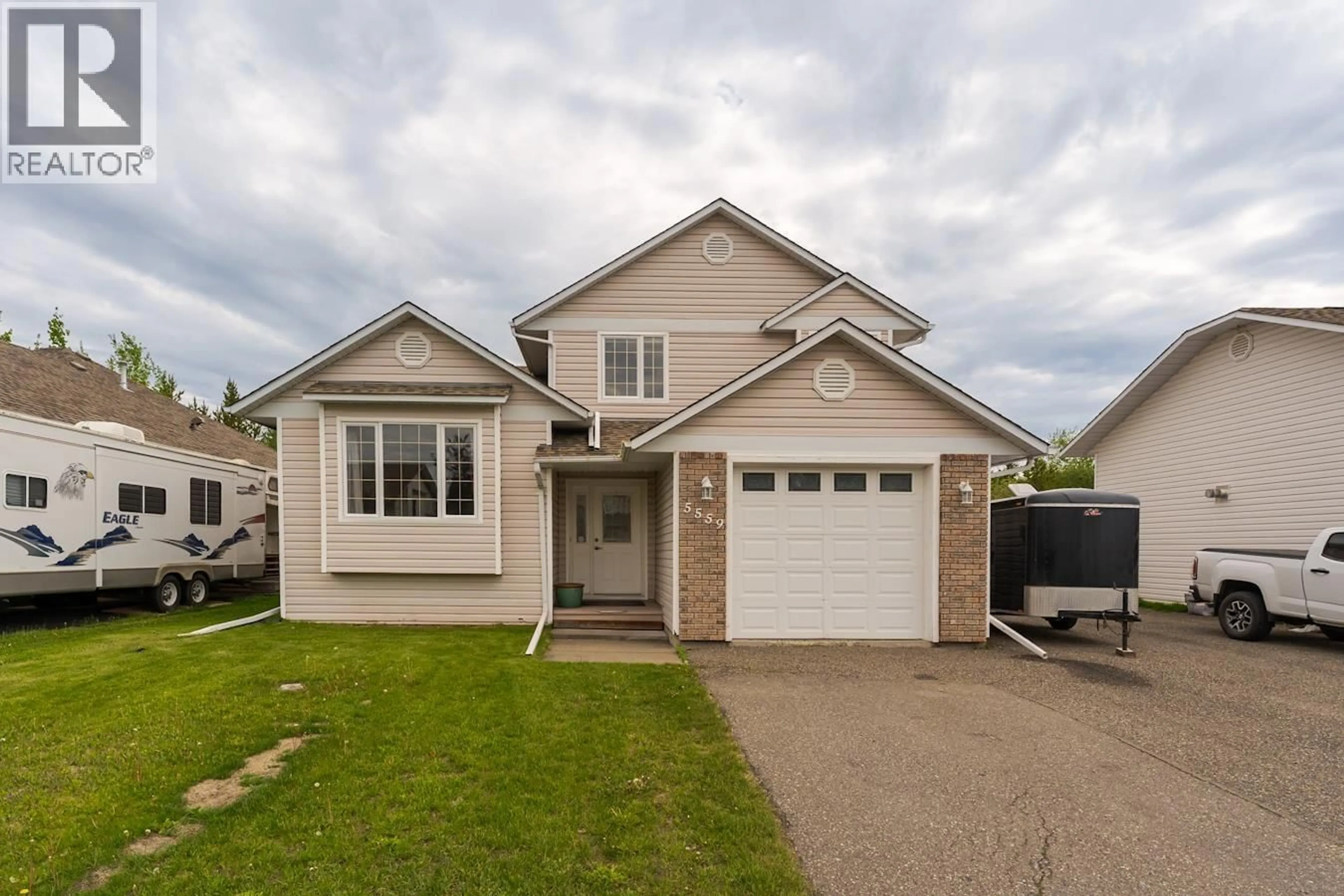 Home with vinyl exterior material, street for 5559 HEYER ROAD, Prince George British Columbia V2N6J3