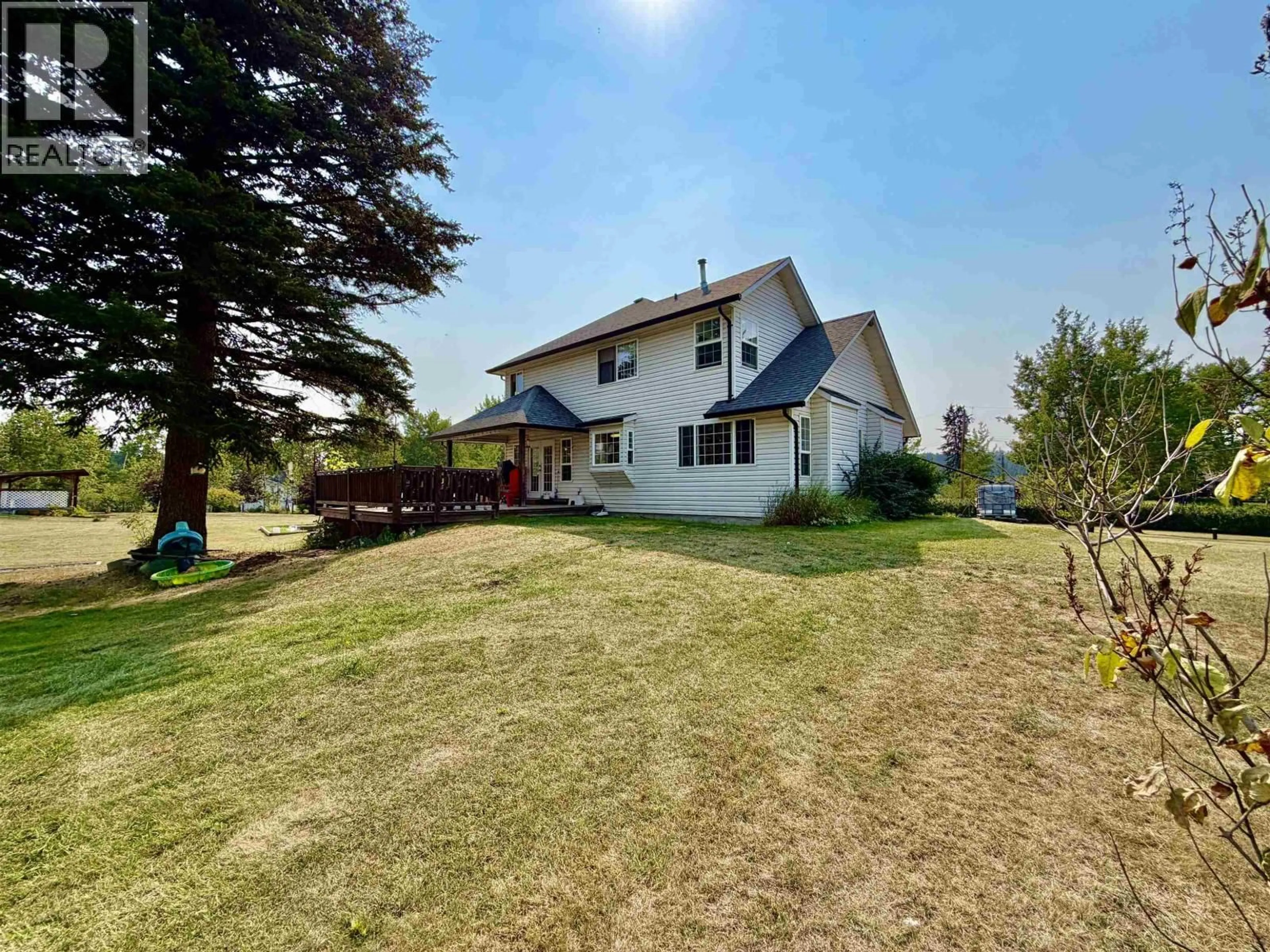 A pic from outside/outdoor area/front of a property/back of a property/a pic from drone, unknown for 5581 LAKESIDE COURT, 103 Mile House British Columbia V0K2E1