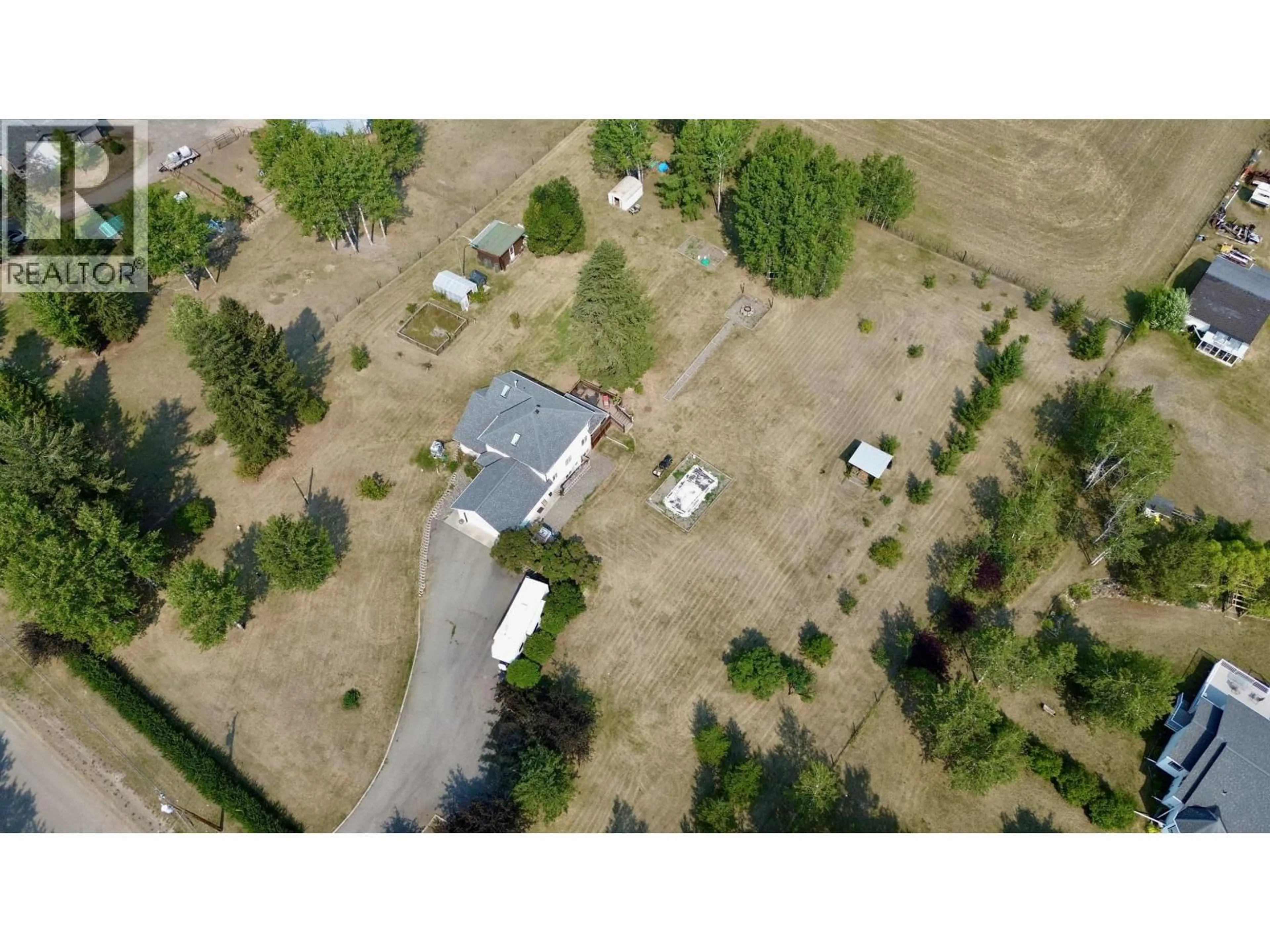 A pic from outside/outdoor area/front of a property/back of a property/a pic from drone, unknown for 5581 LAKESIDE COURT, 103 Mile House British Columbia V0K2E1