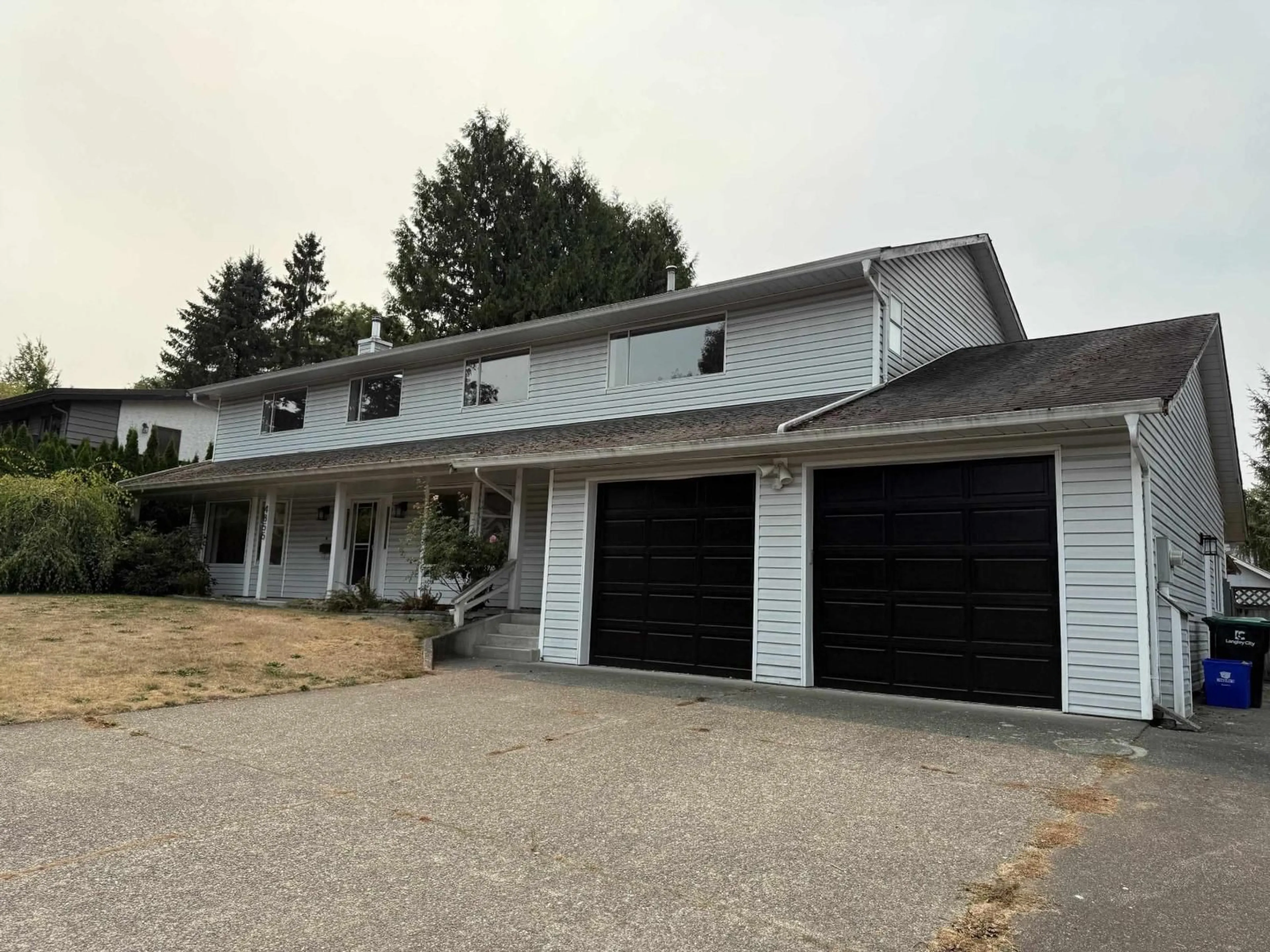 Home with vinyl exterior material, street for 4855 200A STREET, Langley British Columbia V3A5W7