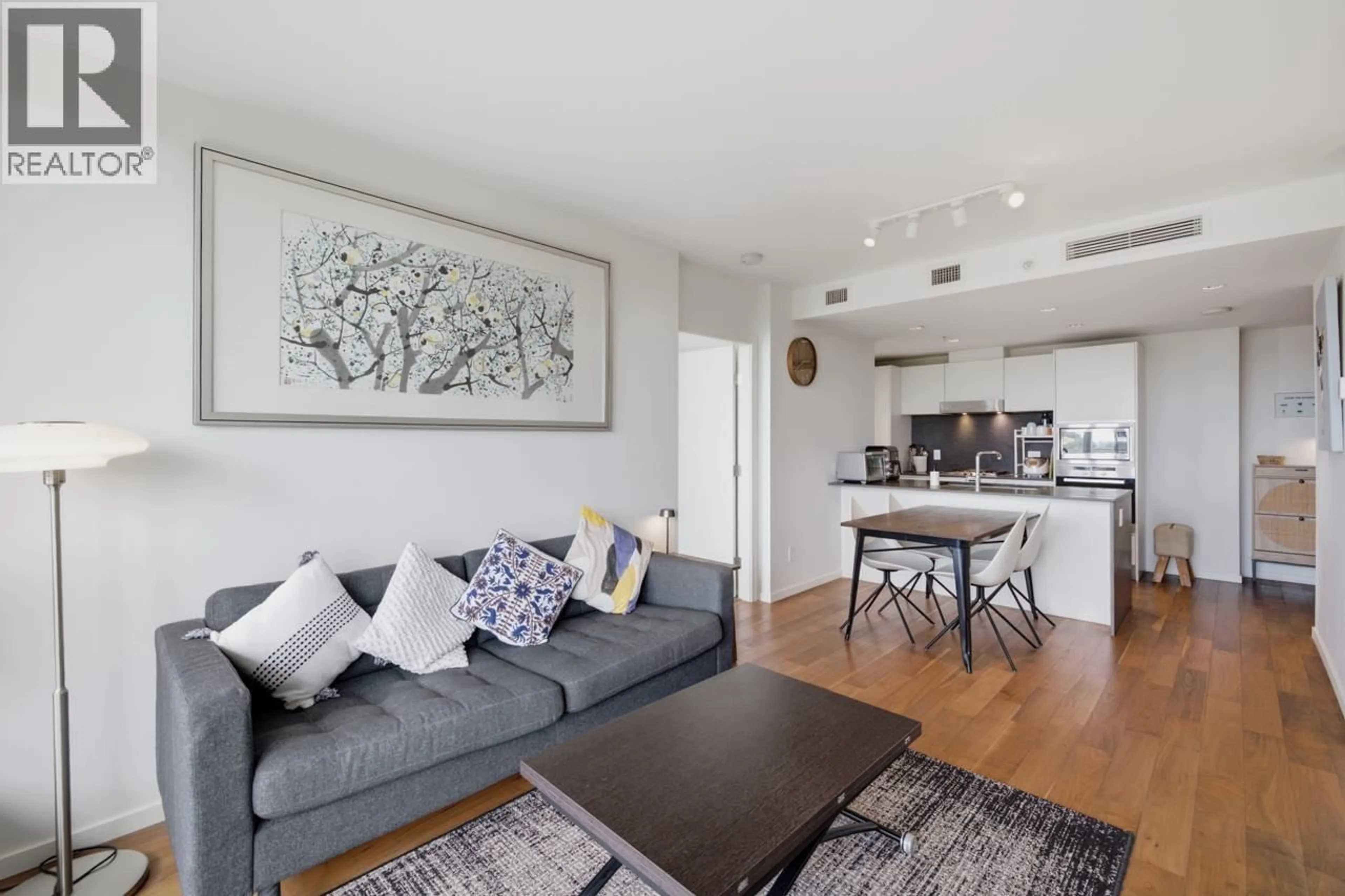 Living room with furniture, wood/laminate floor for 802 - 8488 CORNISH STREET, Vancouver British Columbia V6P0C2