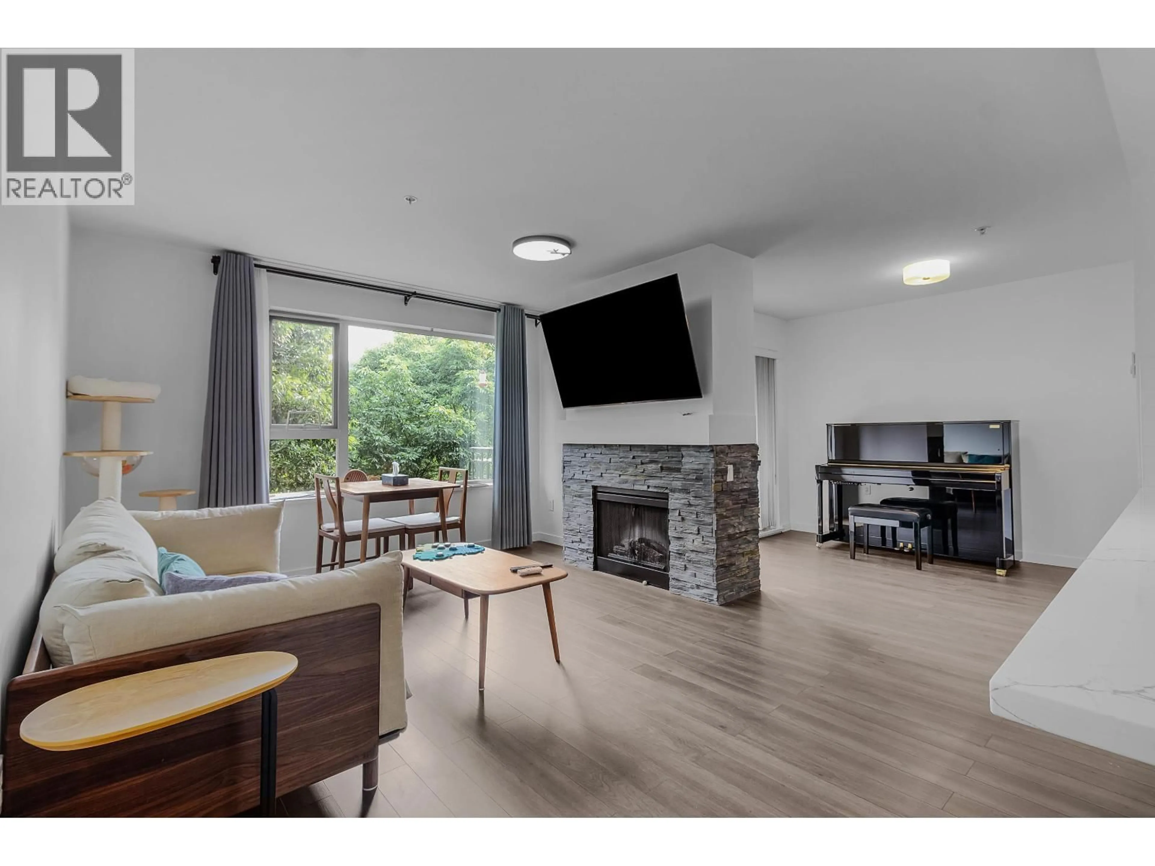 Living room with furniture, wood/laminate floor for 309 - 200 KLAHANIE DRIVE, Port Moody British Columbia V3H5K7