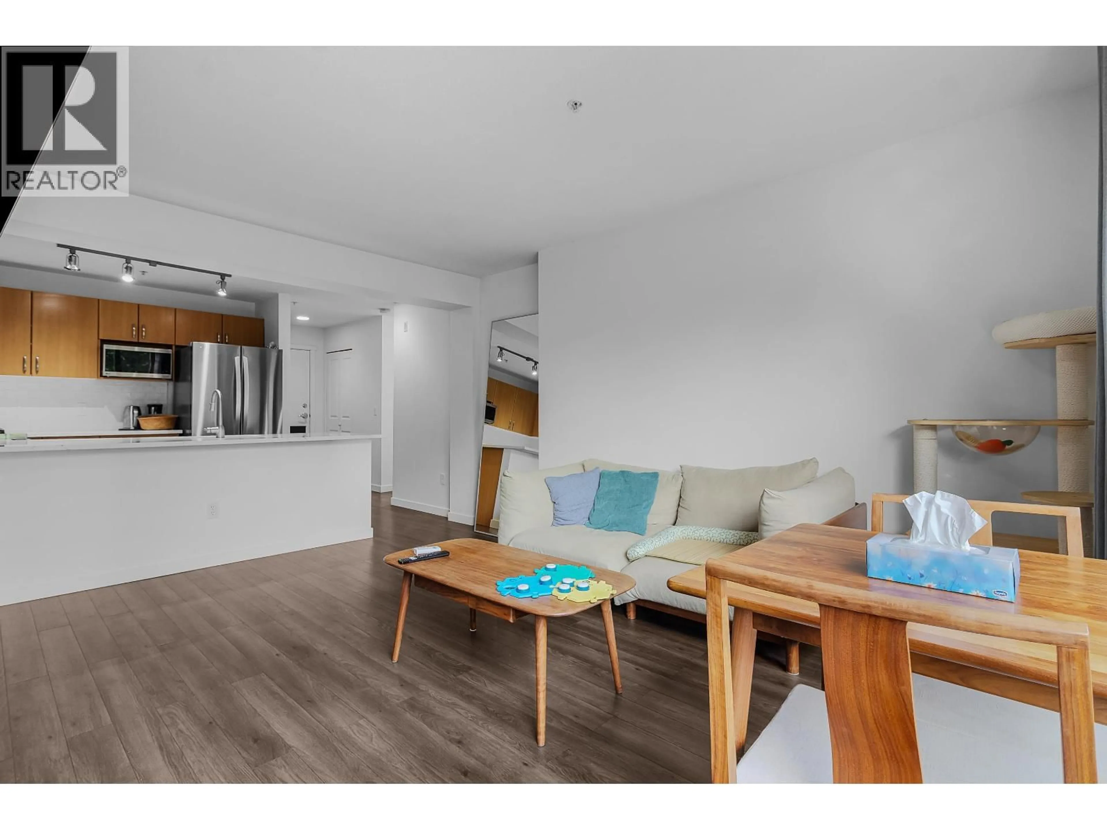 Living room with furniture, wood/laminate floor for 309 - 200 KLAHANIE DRIVE, Port Moody British Columbia V3H5K7