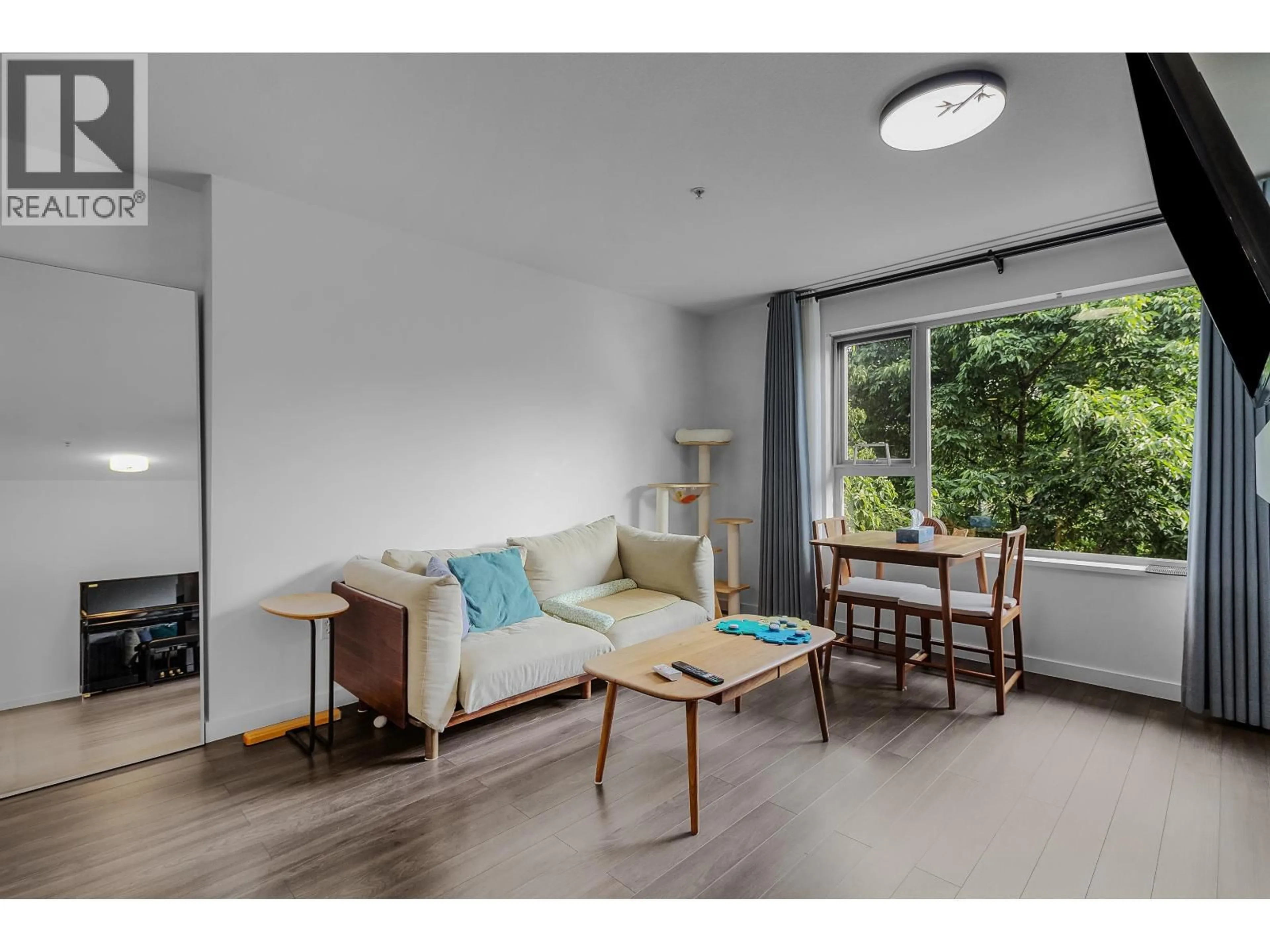 Living room with furniture, wood/laminate floor for 309 - 200 KLAHANIE DRIVE, Port Moody British Columbia V3H5K7
