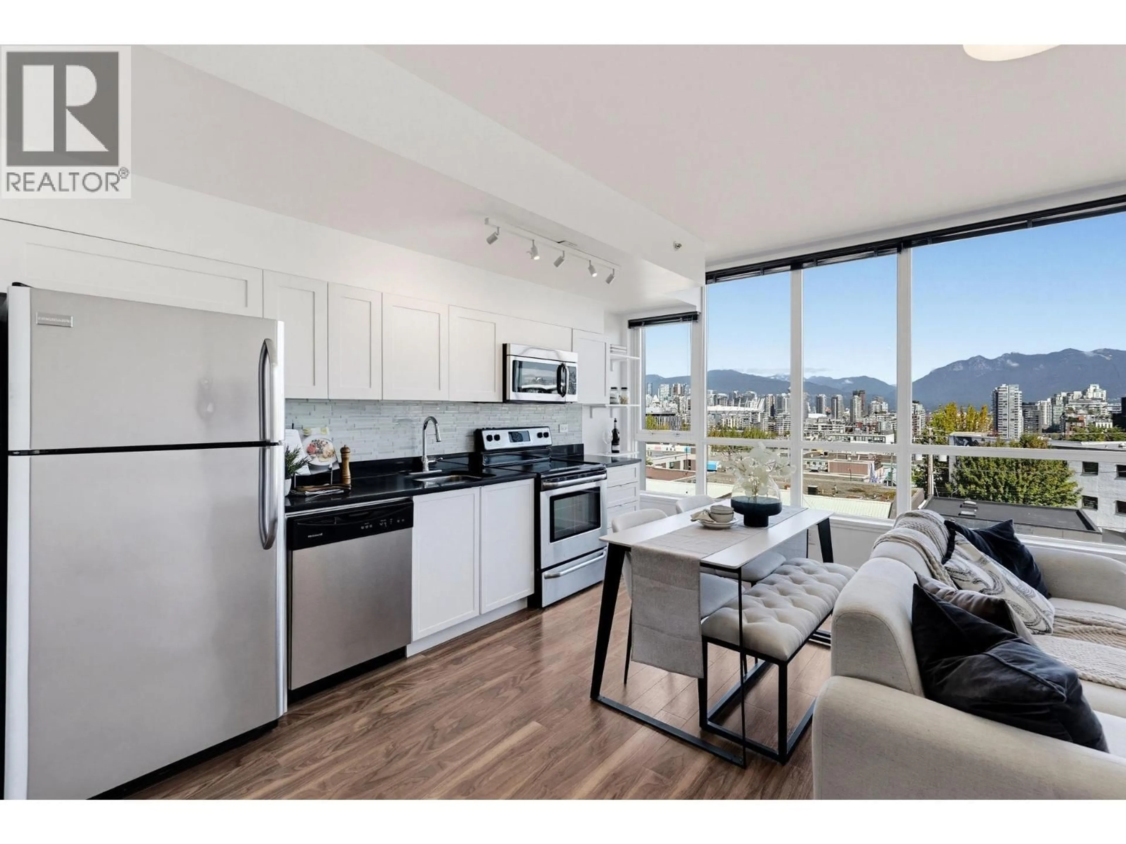 Open concept kitchen, wood/laminate floor for 409 - 2511 QUEBEC STREET, Vancouver British Columbia V5T0B6