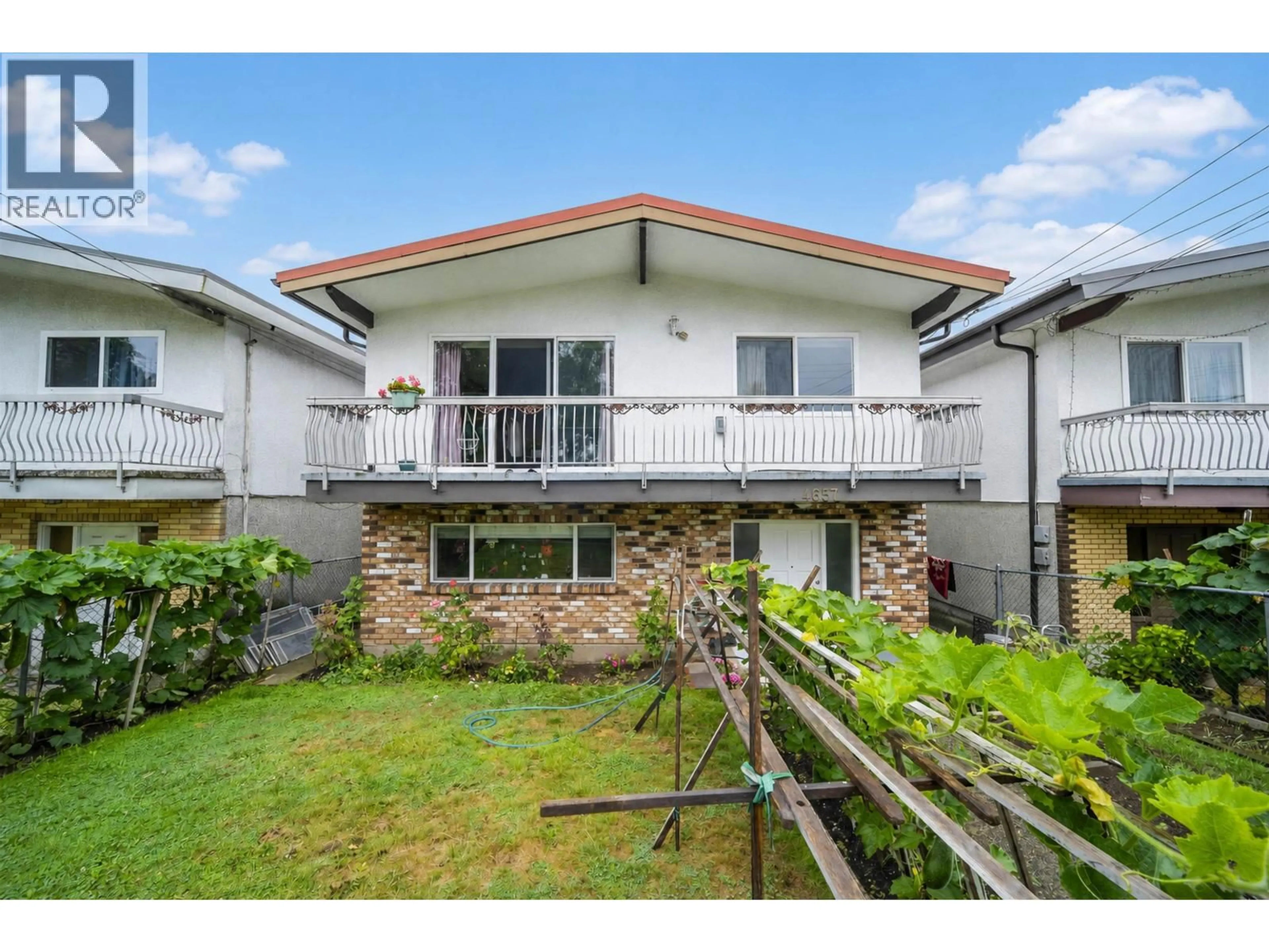 A pic from outside/outdoor area/front of a property/back of a property/a pic from drone, street for 4657 SLOCAN STREET, Vancouver British Columbia V5R1Z8