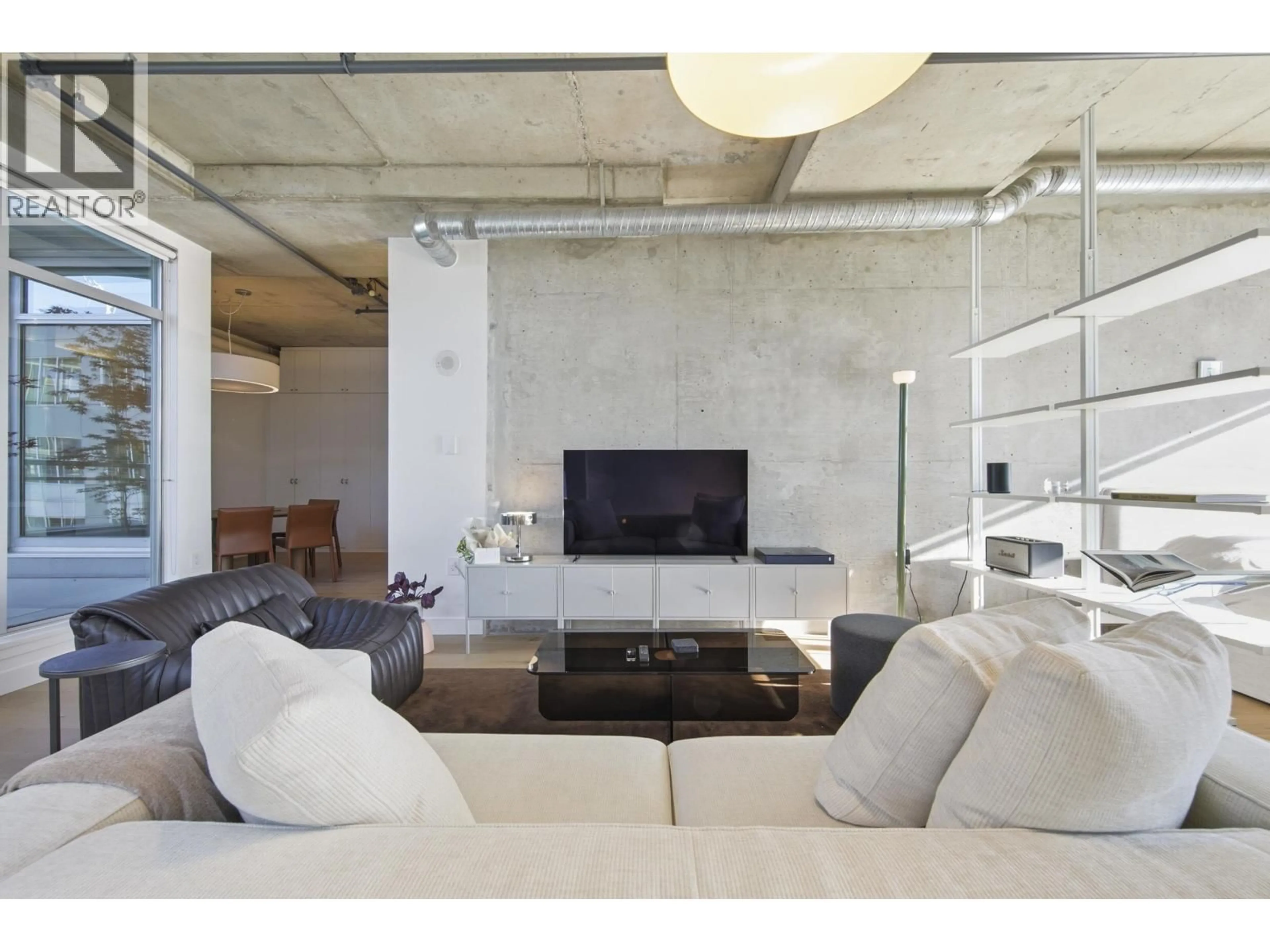 Living room with furniture, cement floor for 604 - 495 6TH AVENUE, Vancouver British Columbia V5Y1L3