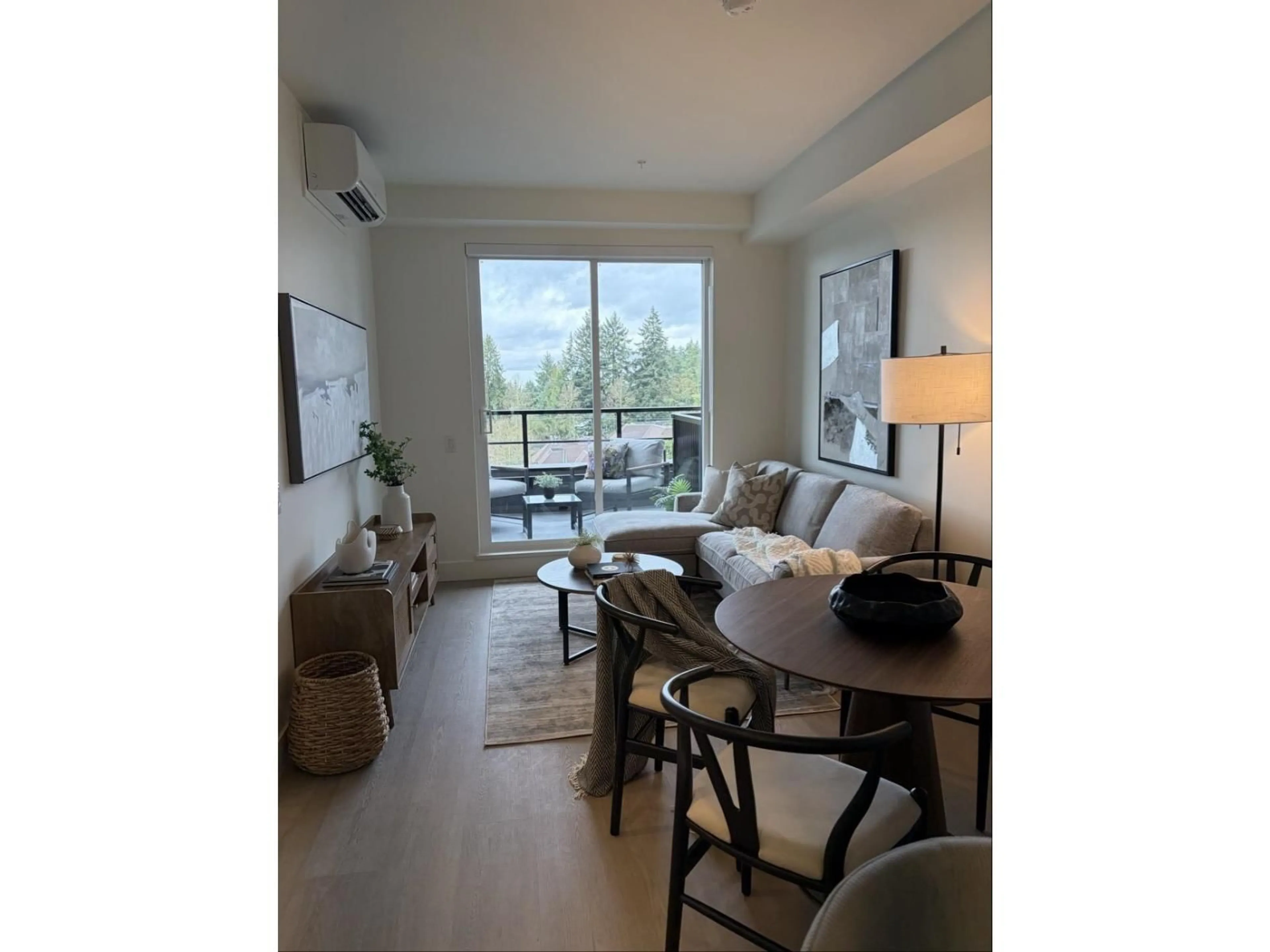 Living room with furniture, wood/laminate floor for 104 - 10065 133 STREET, Surrey British Columbia V3T3Y6