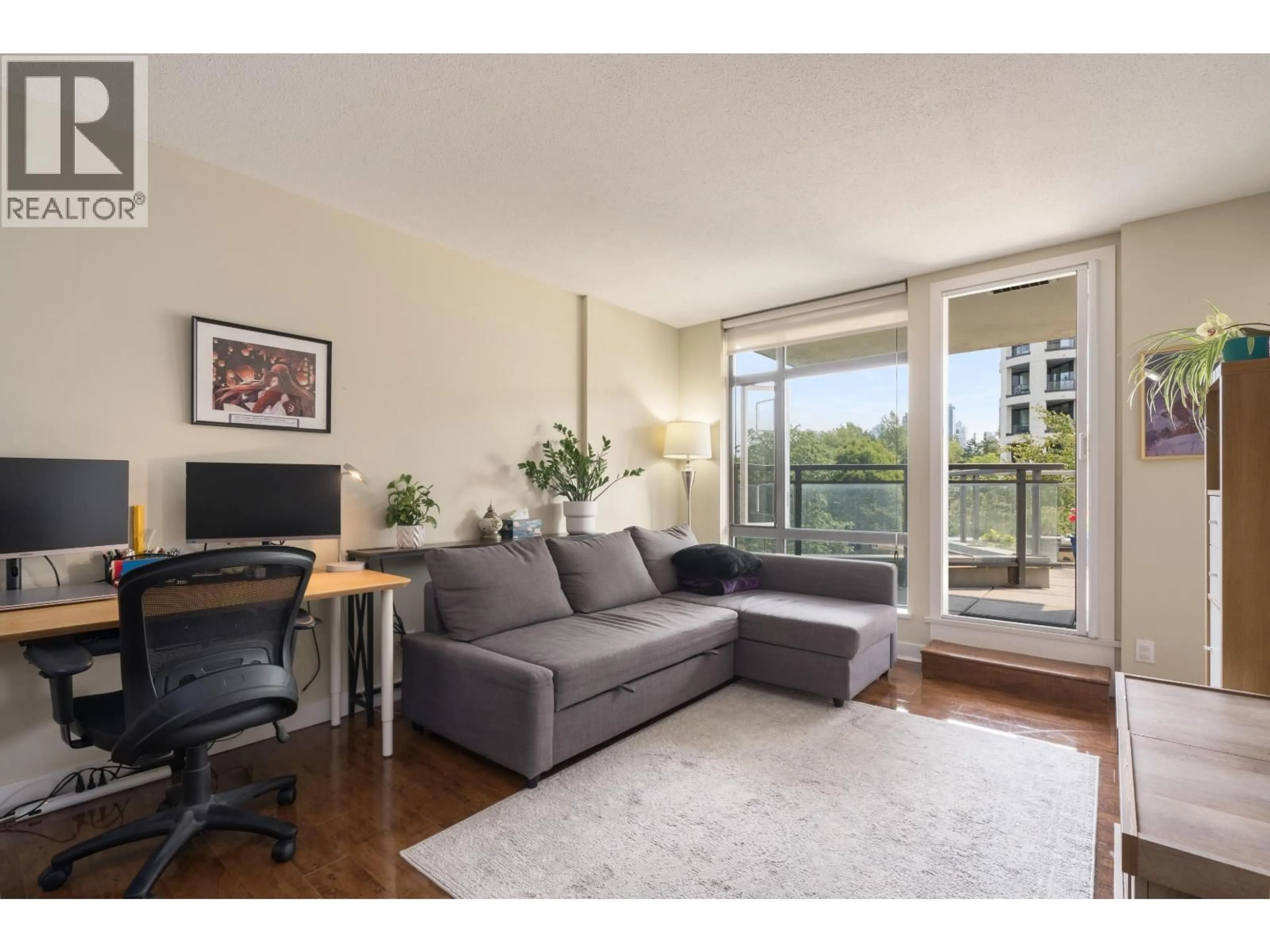 Living room with furniture, wood/laminate floor for 508 - 3660 VANNESS AVENUE, Vancouver British Columbia V5R6H8