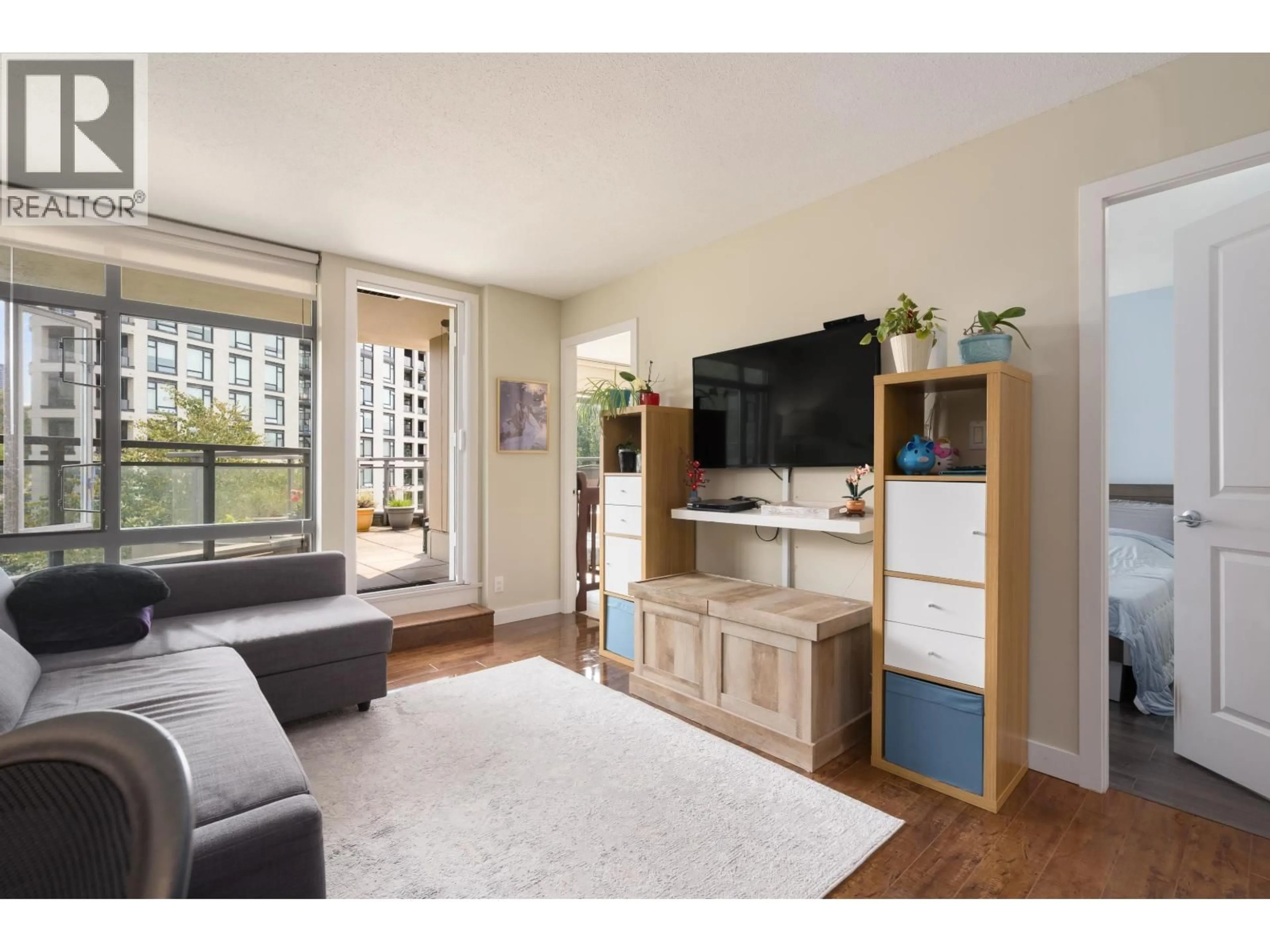 Living room with furniture, wood/laminate floor for 508 - 3660 VANNESS AVENUE, Vancouver British Columbia V5R6H8