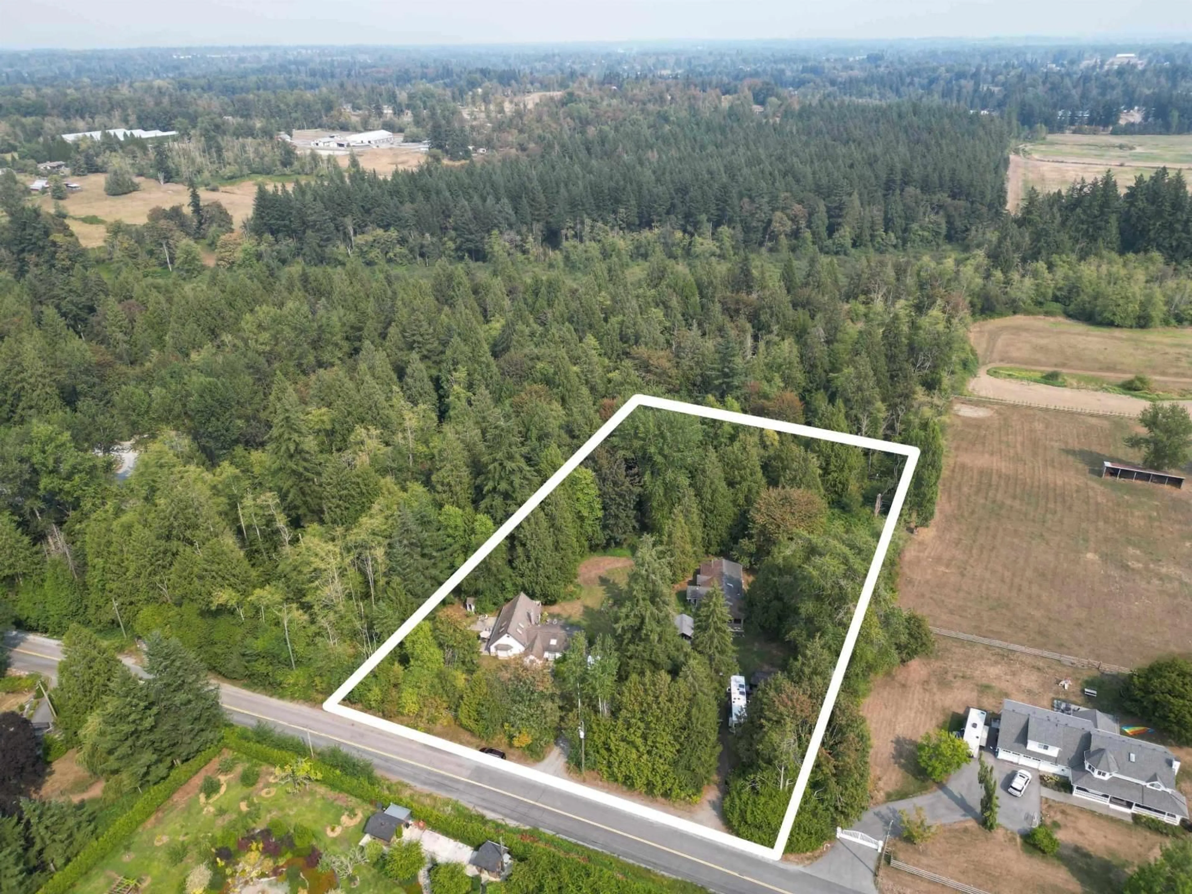A pic from outside/outdoor area/front of a property/back of a property/a pic from drone, forest/trees view for 410 224 STREET, Langley British Columbia V2Z2W5
