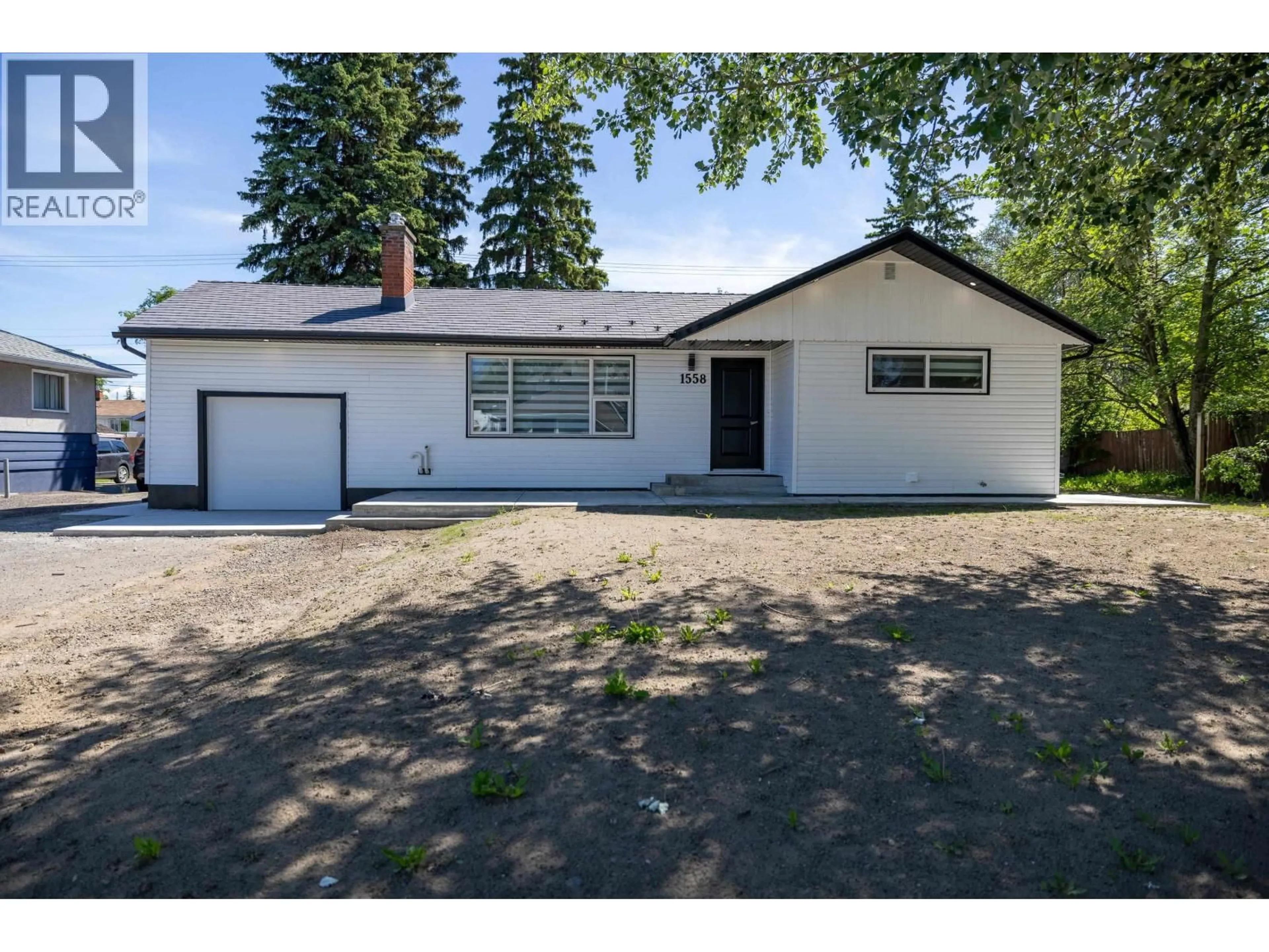 Home with vinyl exterior material, street for 1558 CARNEY STREET, Prince George British Columbia V2M2L5