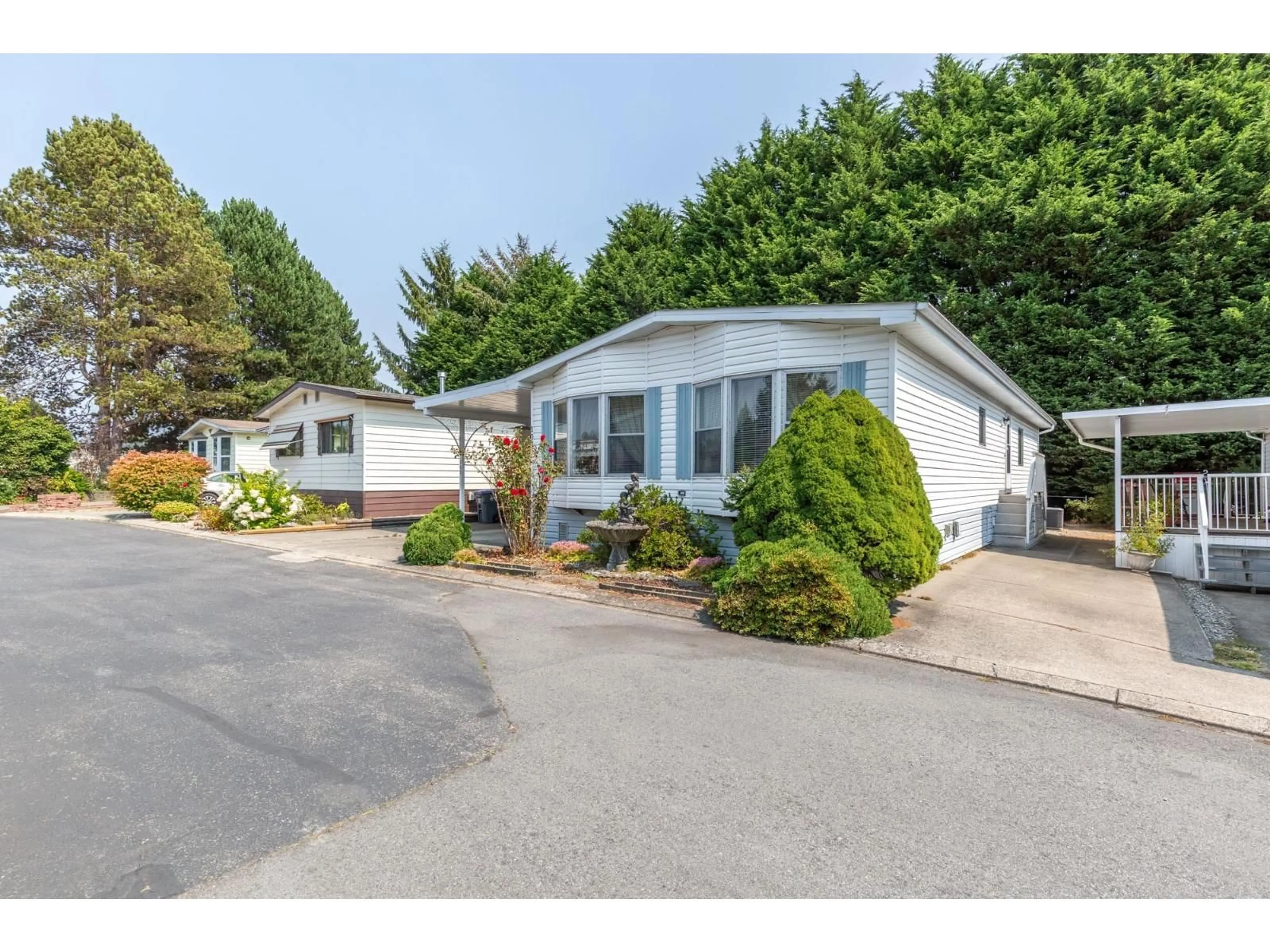 Home with vinyl exterior material, street for 103 - 2062 KING GEORGE BOULEVARD, Surrey British Columbia V4A5A2