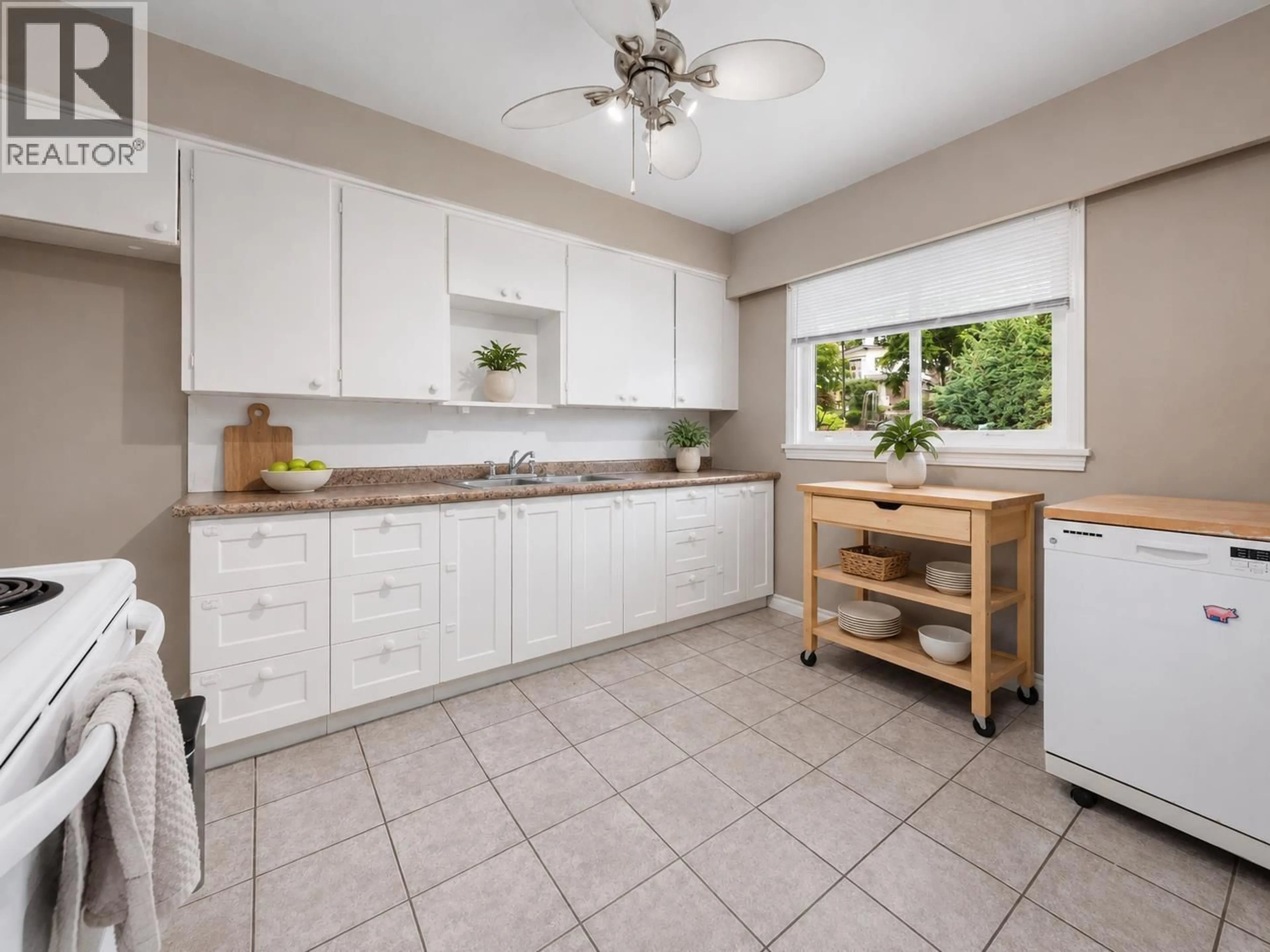 Standard kitchen, ceramic/tile floor for 4561 NANAIMO STREET, Vancouver British Columbia V5N5J5