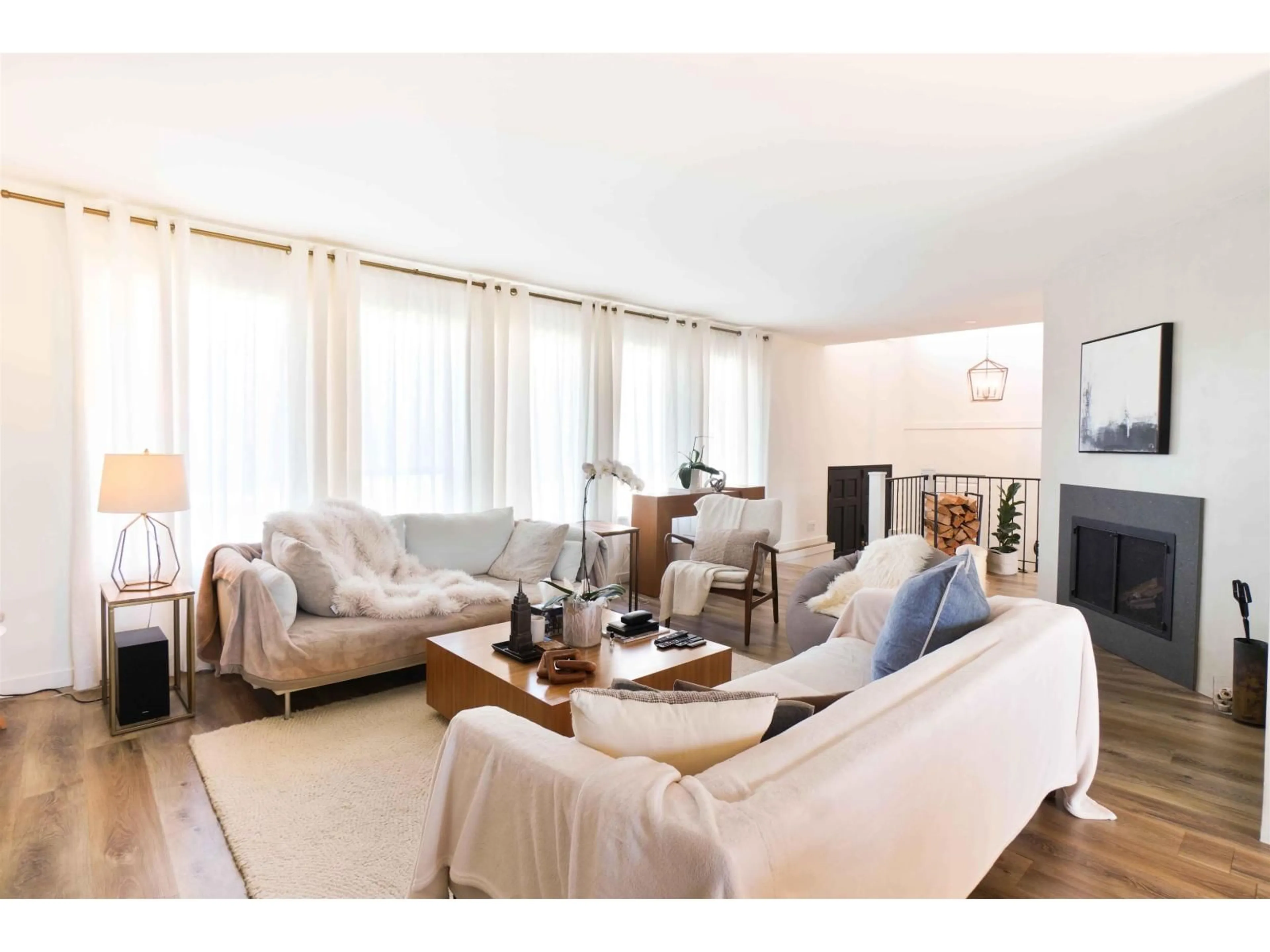 Living room with furniture, wood/laminate floor for 22444 72 AVENUE, Langley British Columbia V2Y2K4