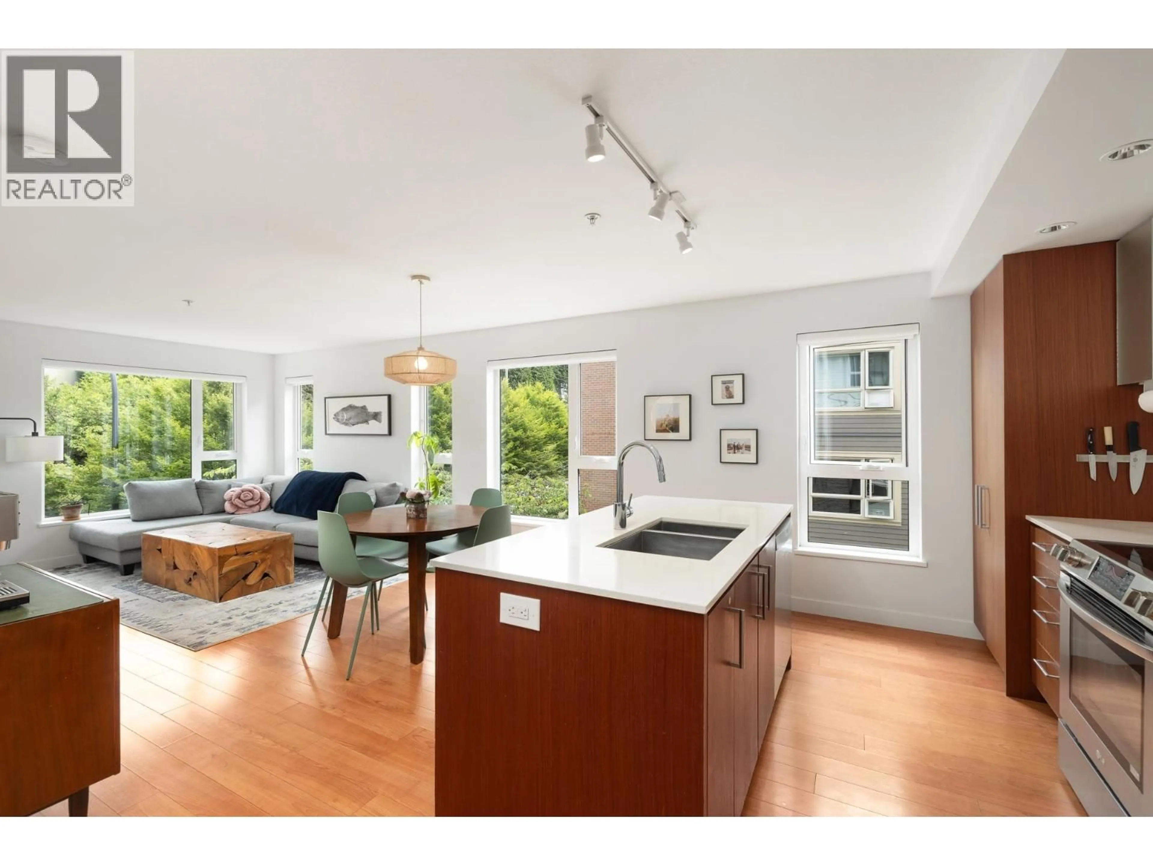 Open concept kitchen, wood/laminate floor for 316 - 221 3RD STREET, North Vancouver British Columbia V7L0C1