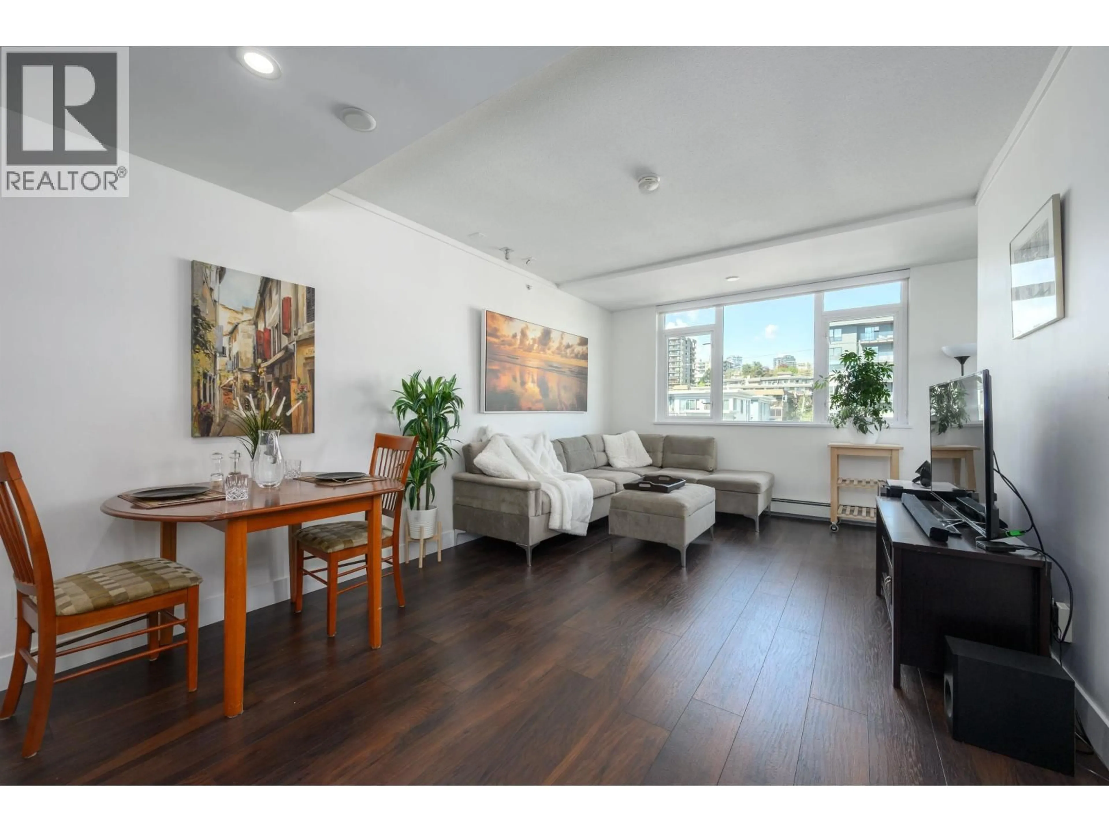 Living room with furniture, wood/laminate floor for 504 - 131 3RD STREET, North Vancouver British Columbia V7L0E3