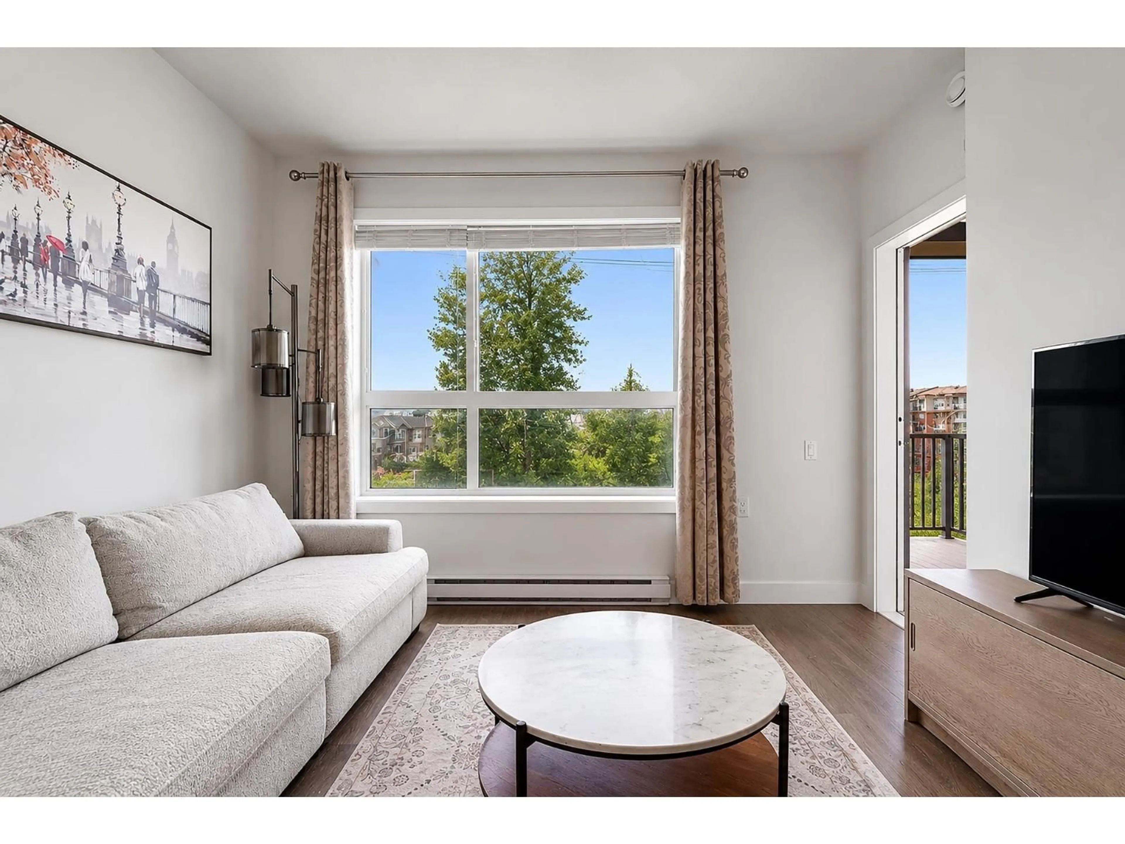 Living room with furniture, wood/laminate floor for 301 - 20829 77A AVENUE, Langley British Columbia V2Y0Y5