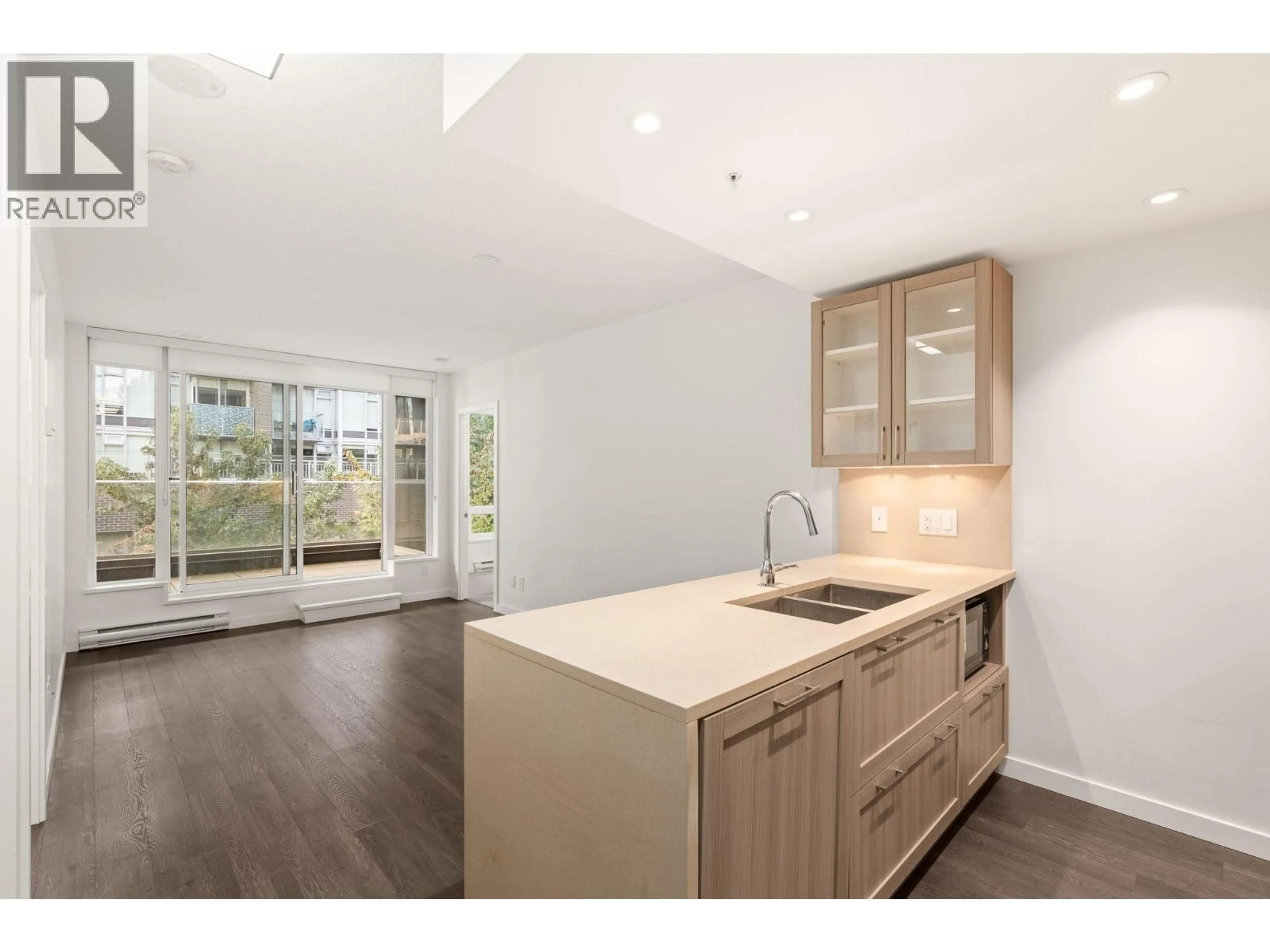 Open concept kitchen, wood/laminate floor for 621 - 5598 ORMIDALE STREET, Vancouver British Columbia V5R0E5